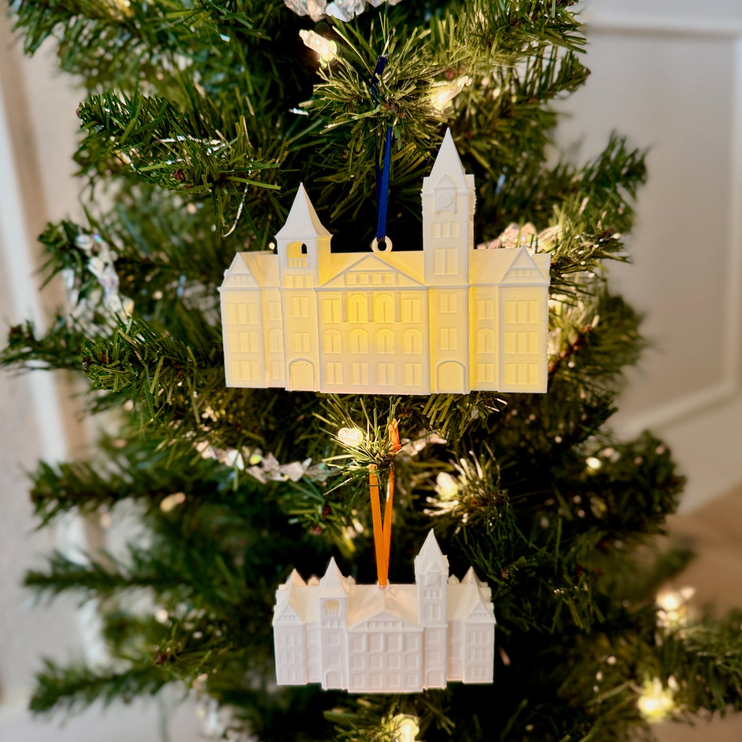 Two Auburn ornaments shown on a tree for an Auburn Tigers fan.