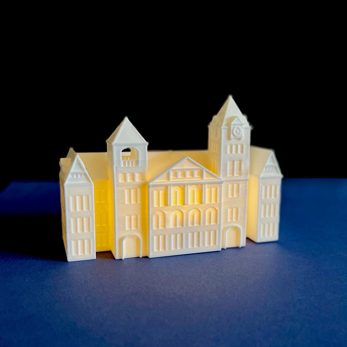 The Auburn University lighted figurine, shown against a blue background.