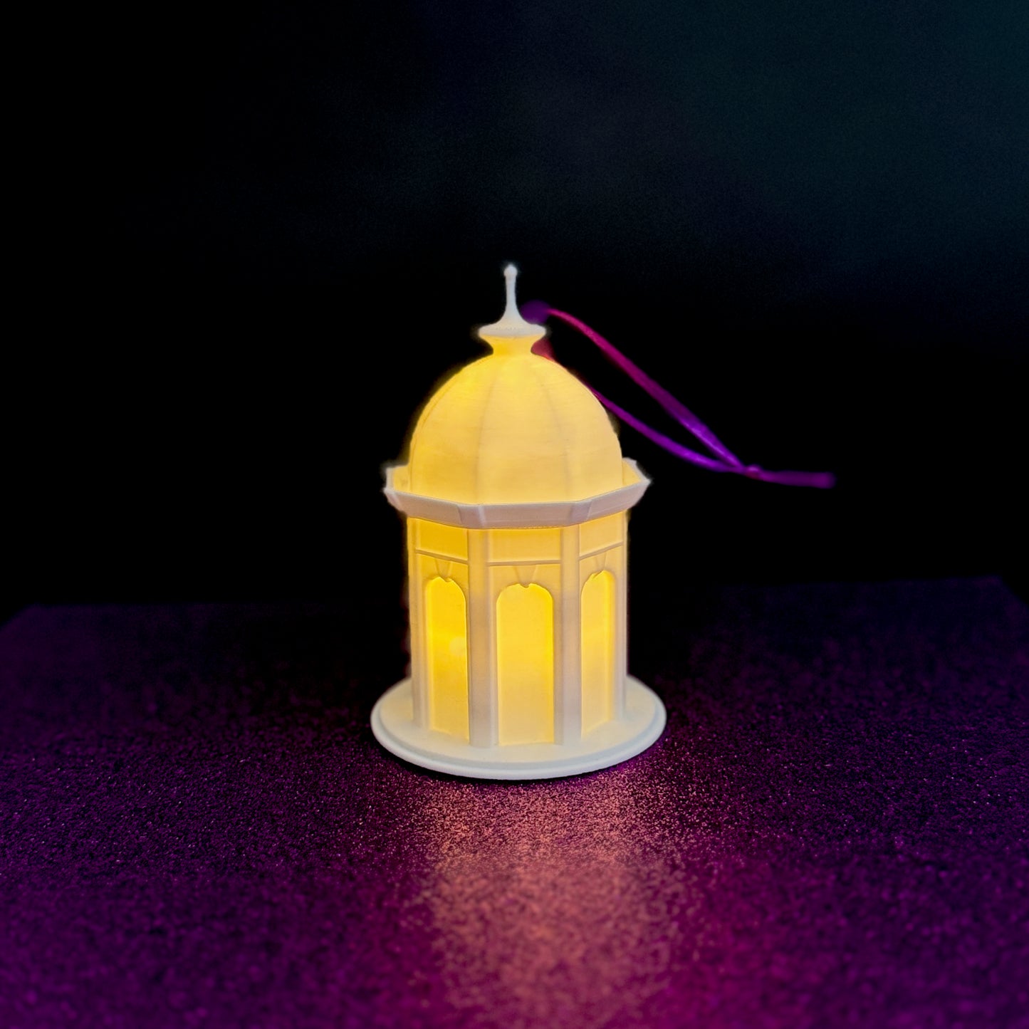 East Carolina ornament of the ECU Cupola, shown against a purple background.