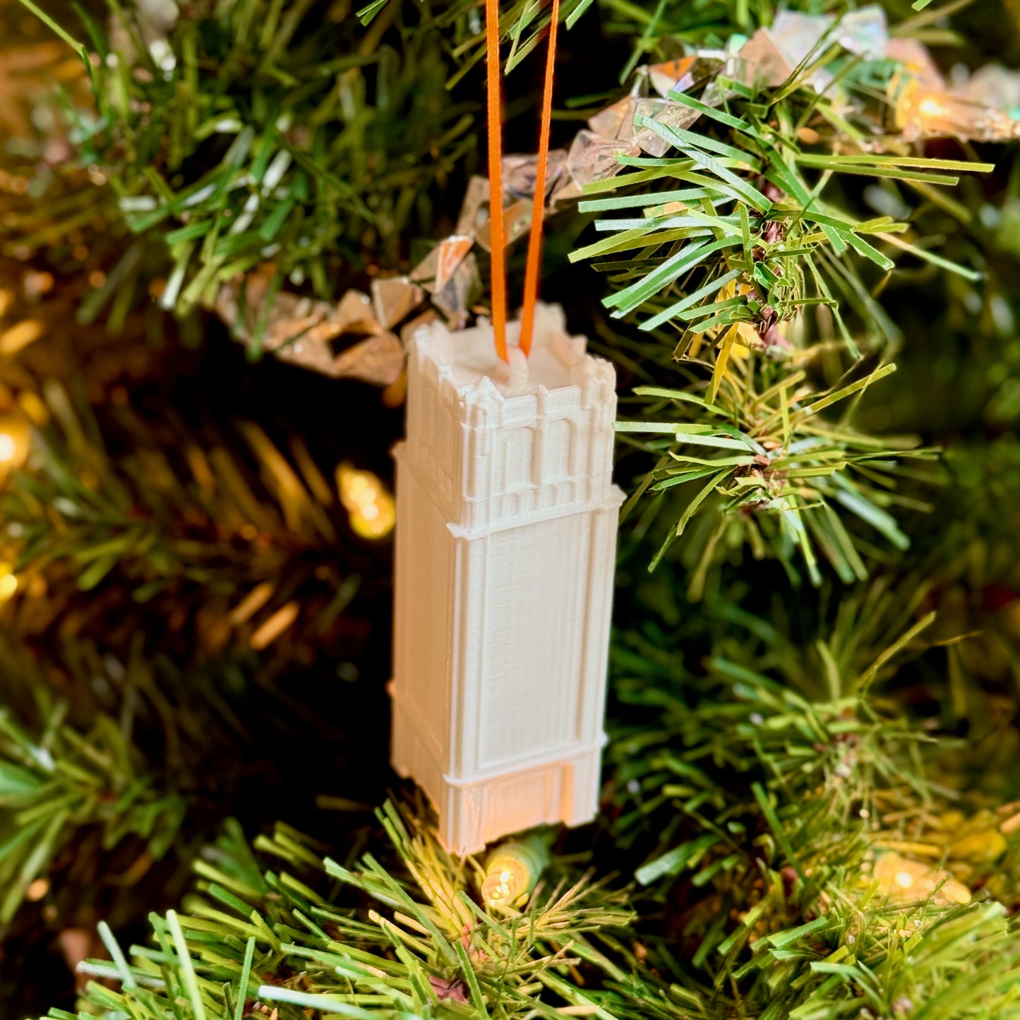 The University of Florida Century Tower ornament shown on a Christmas tree.