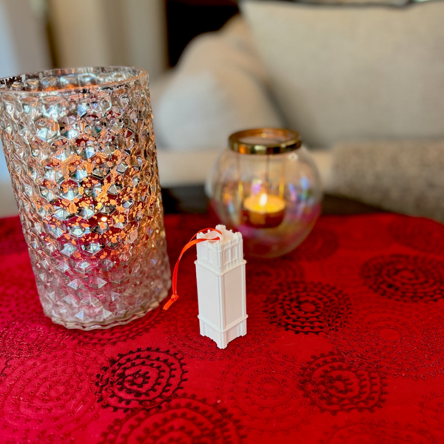 The University of Florida college ornament, shown in a home decorated for Christmas and representing the Century Tower.