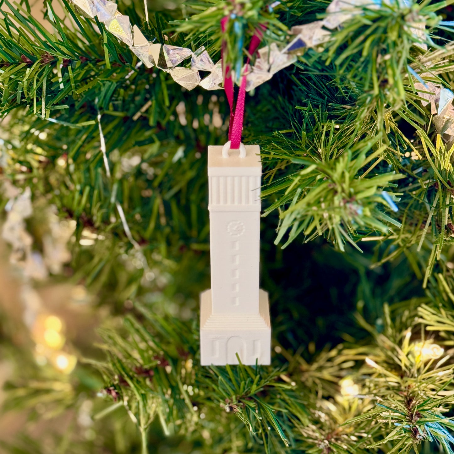 The Texas Aggie ornament depicting the campus, shown on a Texas A&M tree.