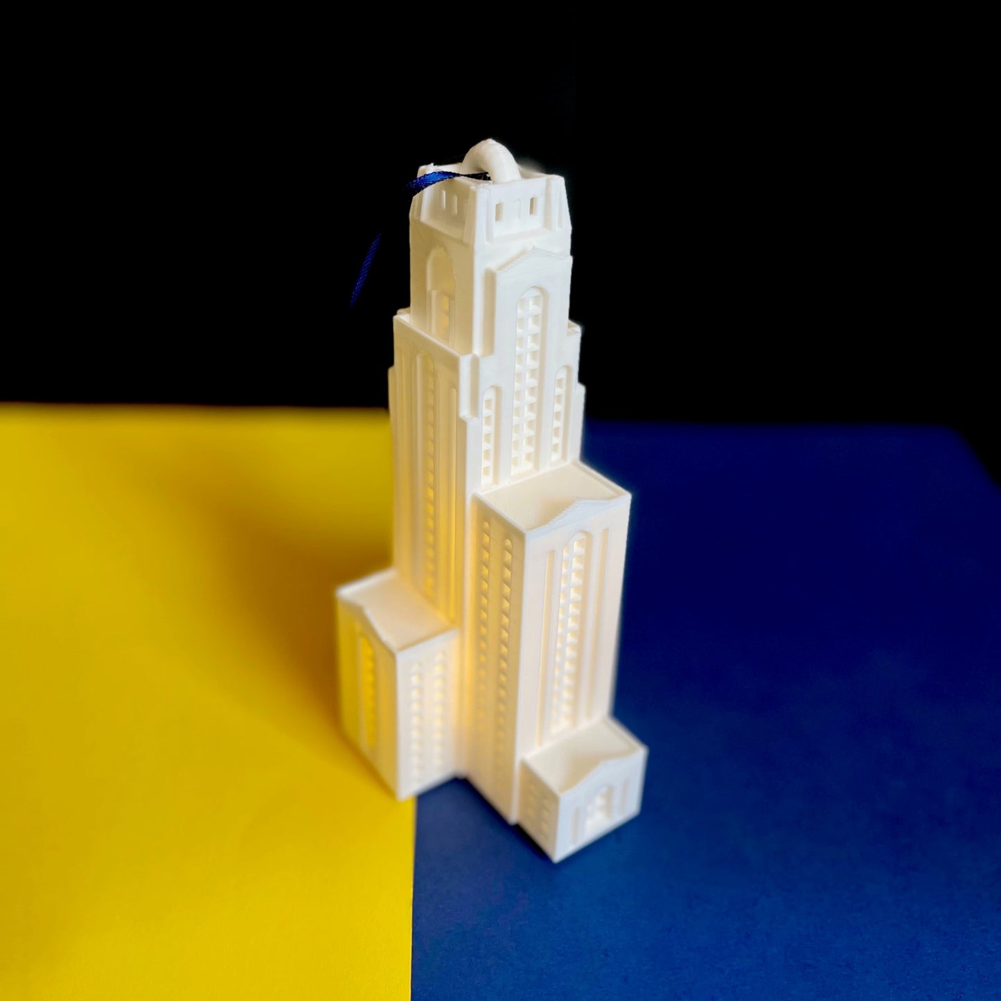 Side view of the University of Pittsburgh Christmas ornament, designed as a replica of the Pitt Cathy.