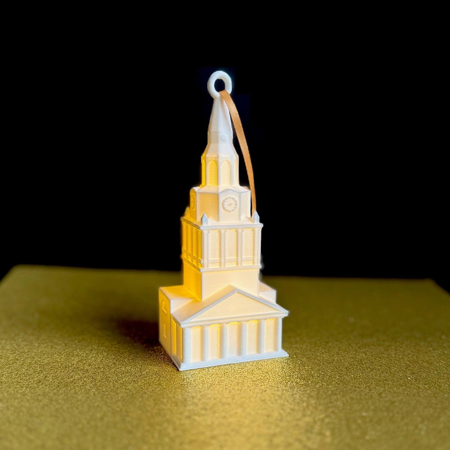 The lighted Wake Forest ornament, shown against a black background.