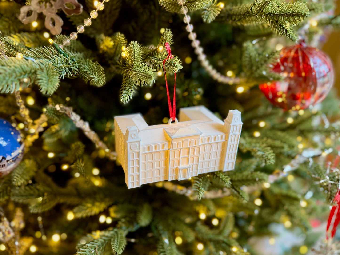 Top view of the University of Arkansas ornament depicting Old Main.