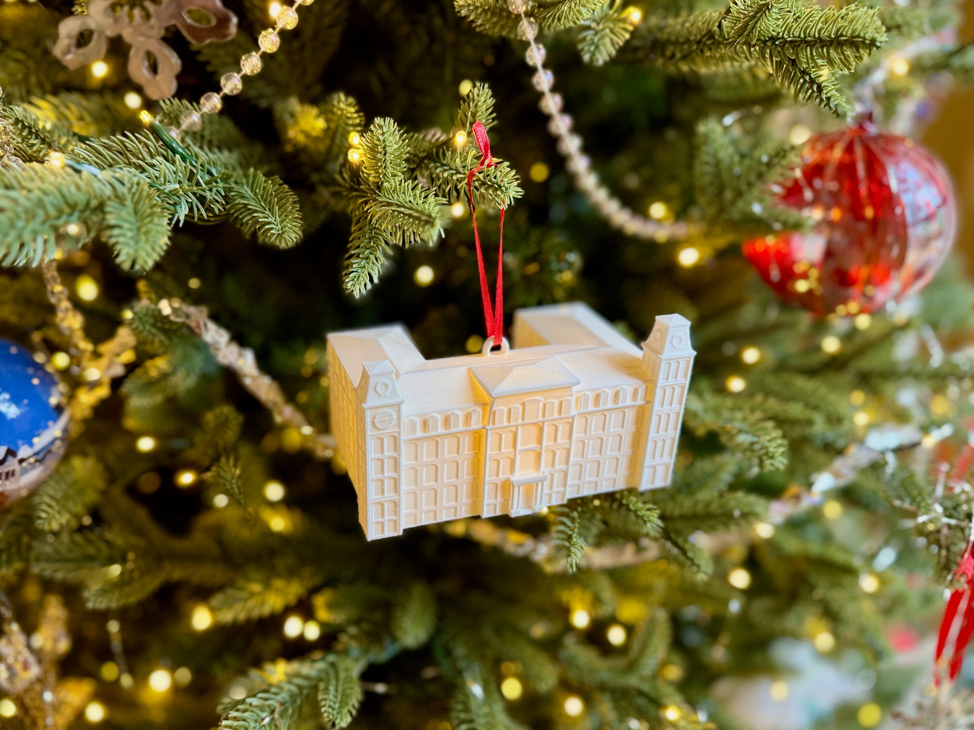 Top view of the University of Arkansas ornament depicting Old Main.