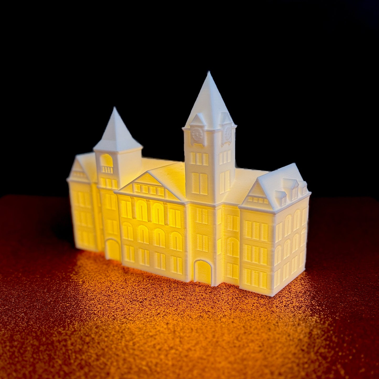 The Auburn Samford Hall figurine with LED light, used as wedding decor.