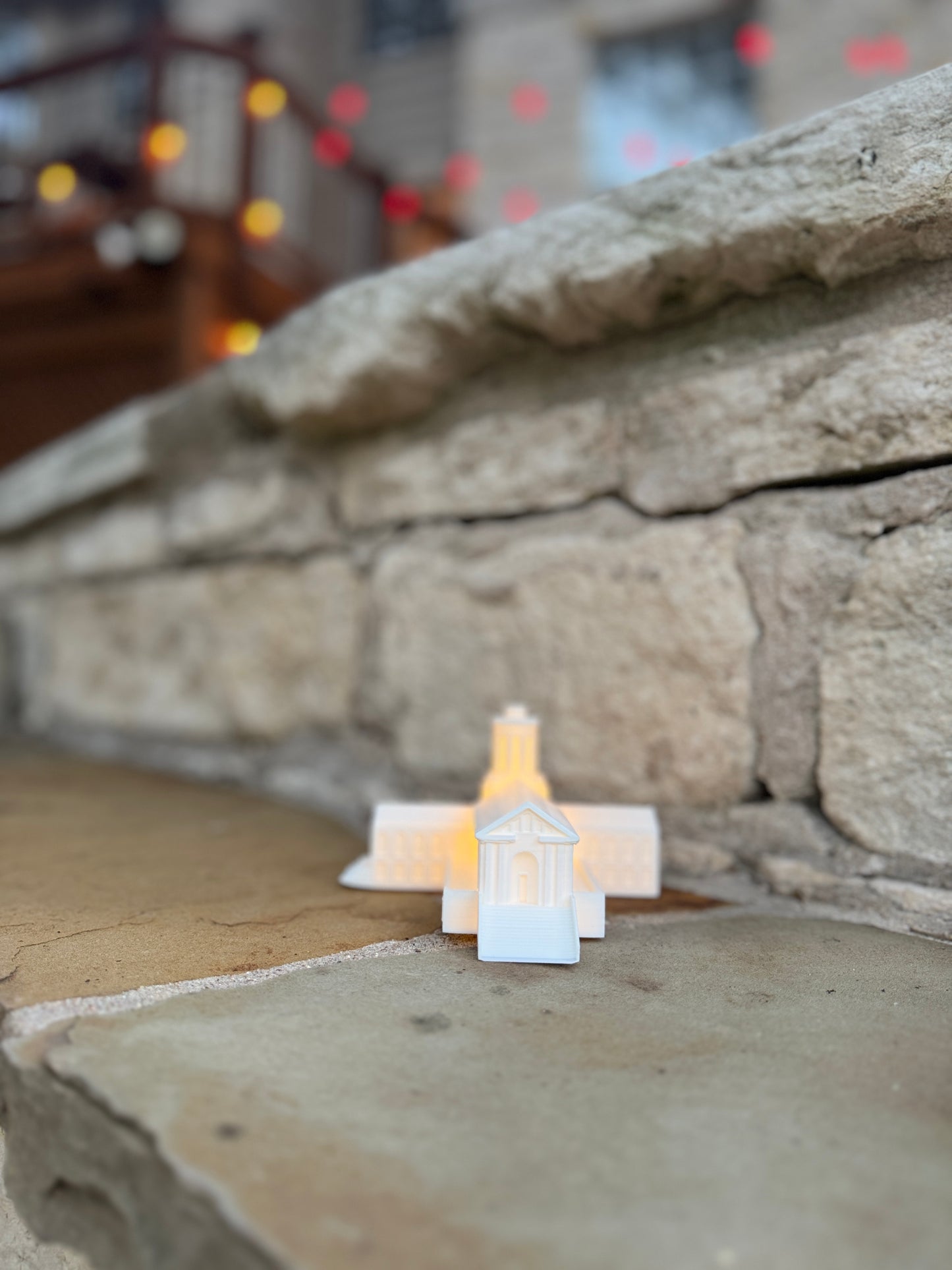 The Carnegie Mellon alumni gift, a figurine designed as a replica of the Hamerschlag Hall building.