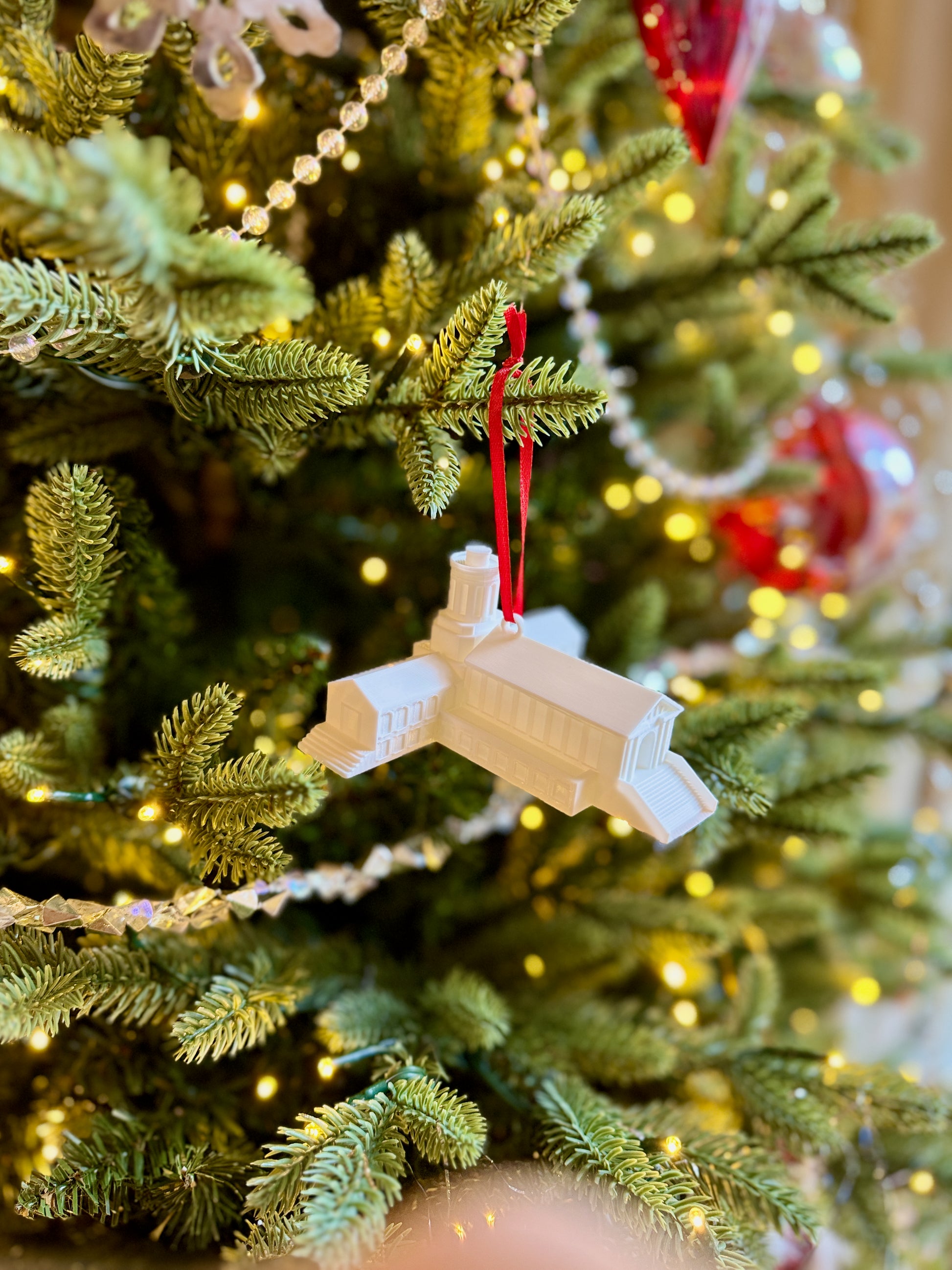 The Carnegie Mellon alumni ornament, shown on a Christmas tree.