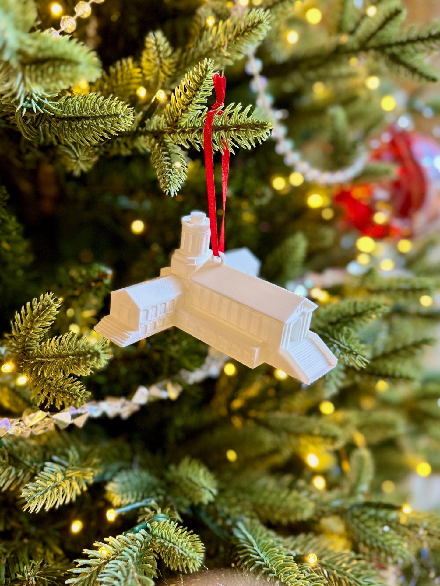 Carnegie Mellon ornament for her, designed as Hamerschlag Hall and shown on a Christmas tree.