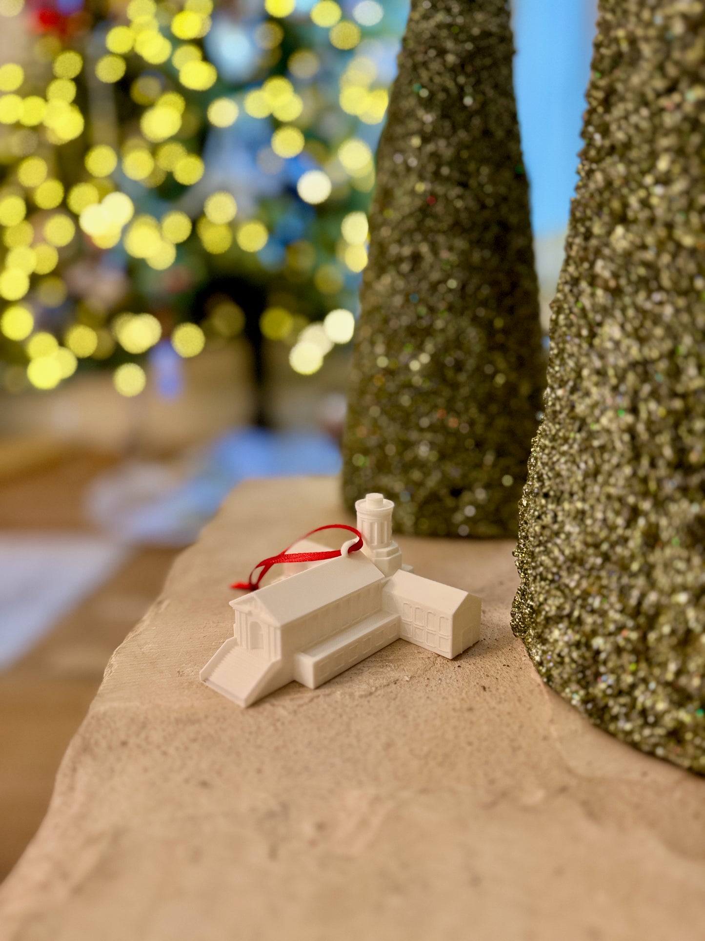 The Carnegie Mellon keepsake ornament for students and alumni, shown in a home decorated for the Holidays.