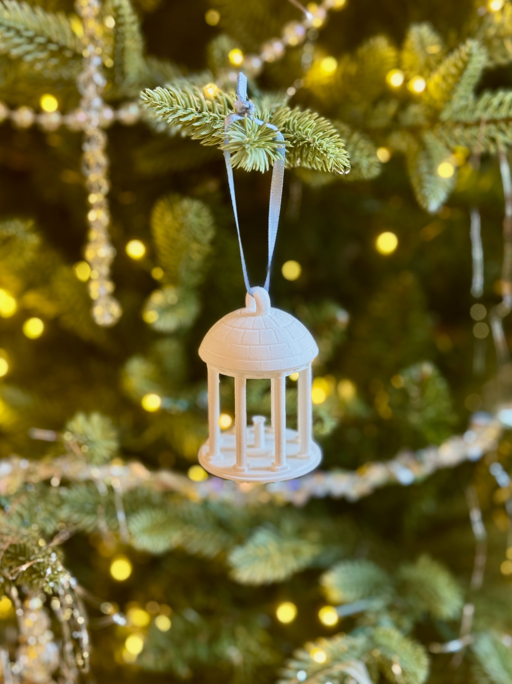 A Christmas ornament for UNC students designed as the Old Well on the Chapel Hill campus.