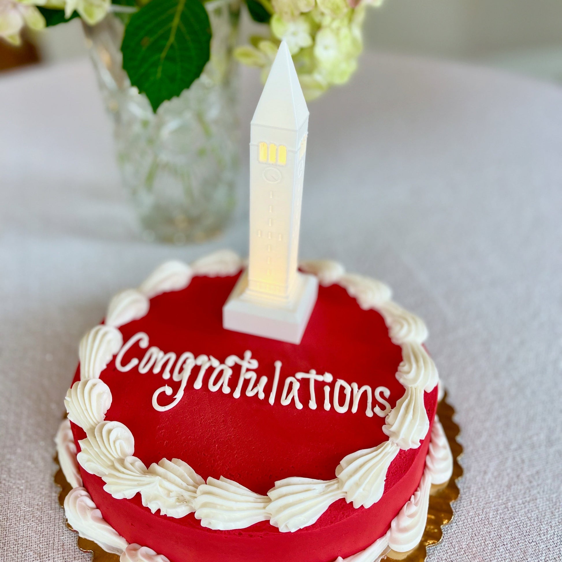 Cornell Cake topper light, shown on a graduation.