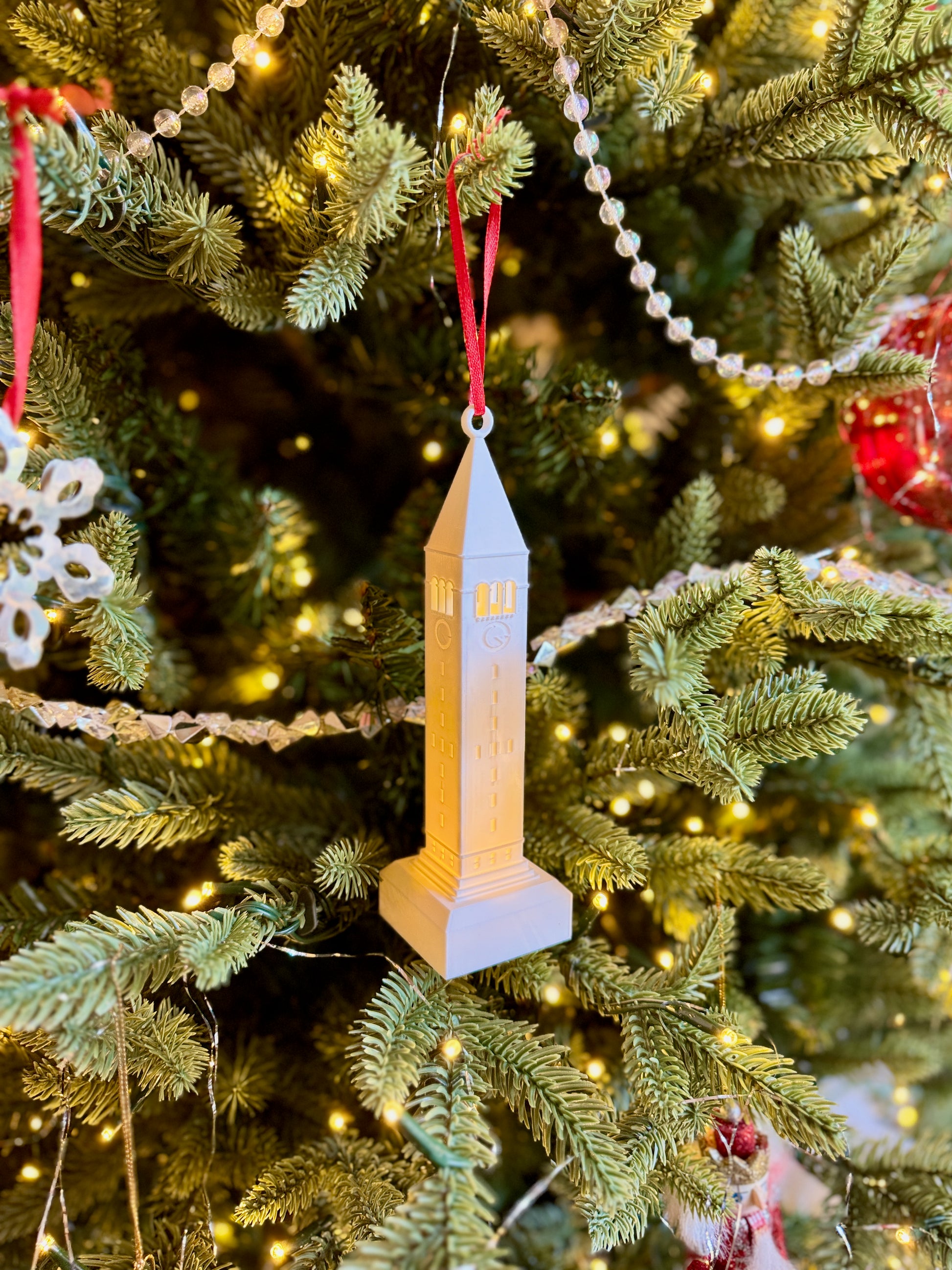 The Cornell alumni ornament featuring the bell tower.