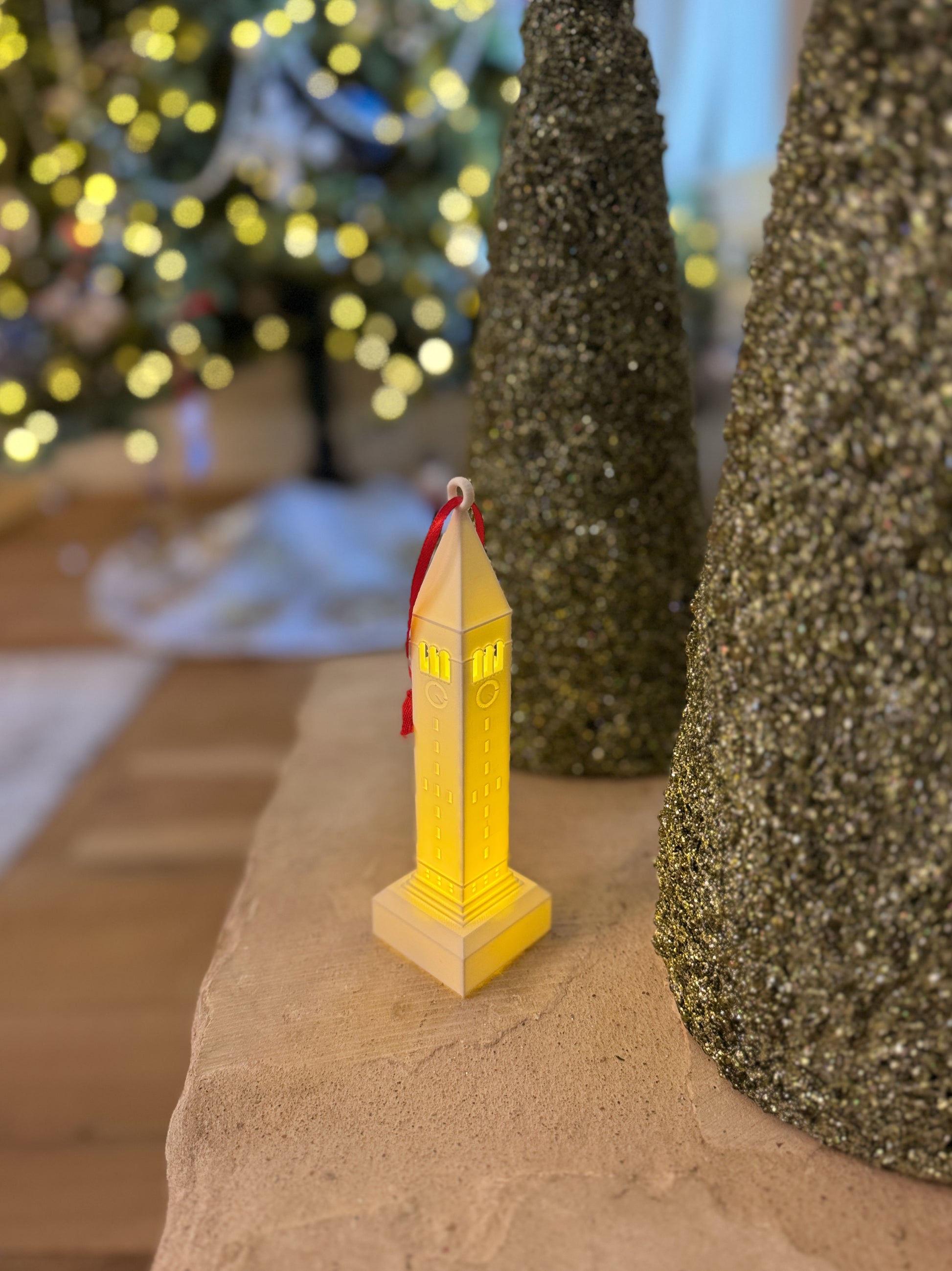 The Cornell bell tower ornament for alumni, shown in a home decorated for the Holidays.