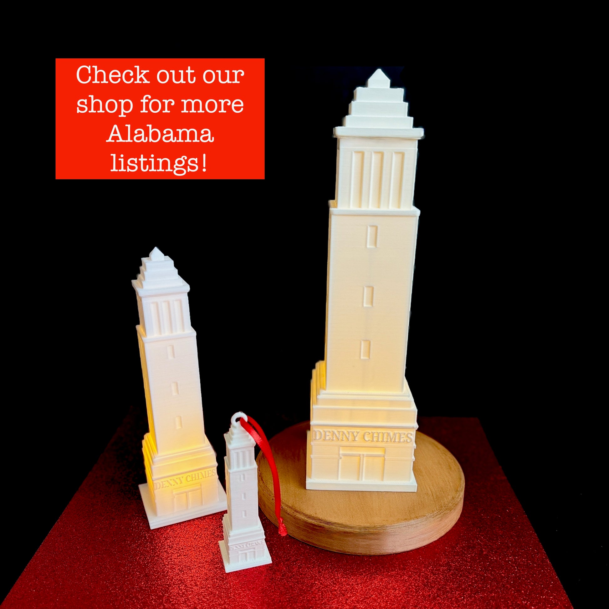 The University of Alabama Denny Chimes gift collection, including a large and small light and an Alabama ornament.