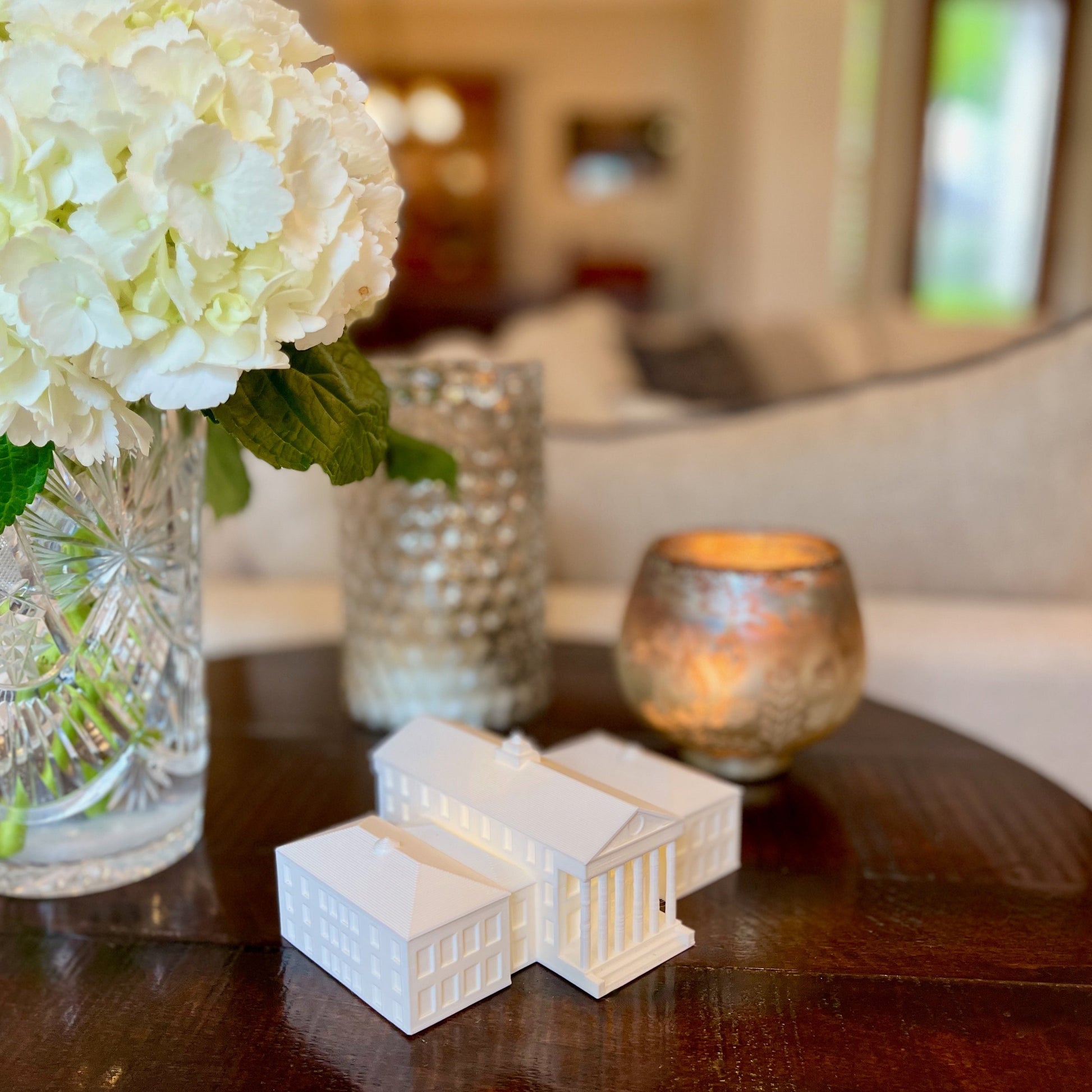 The Ole Miss home decoration, shown styled in a living room.