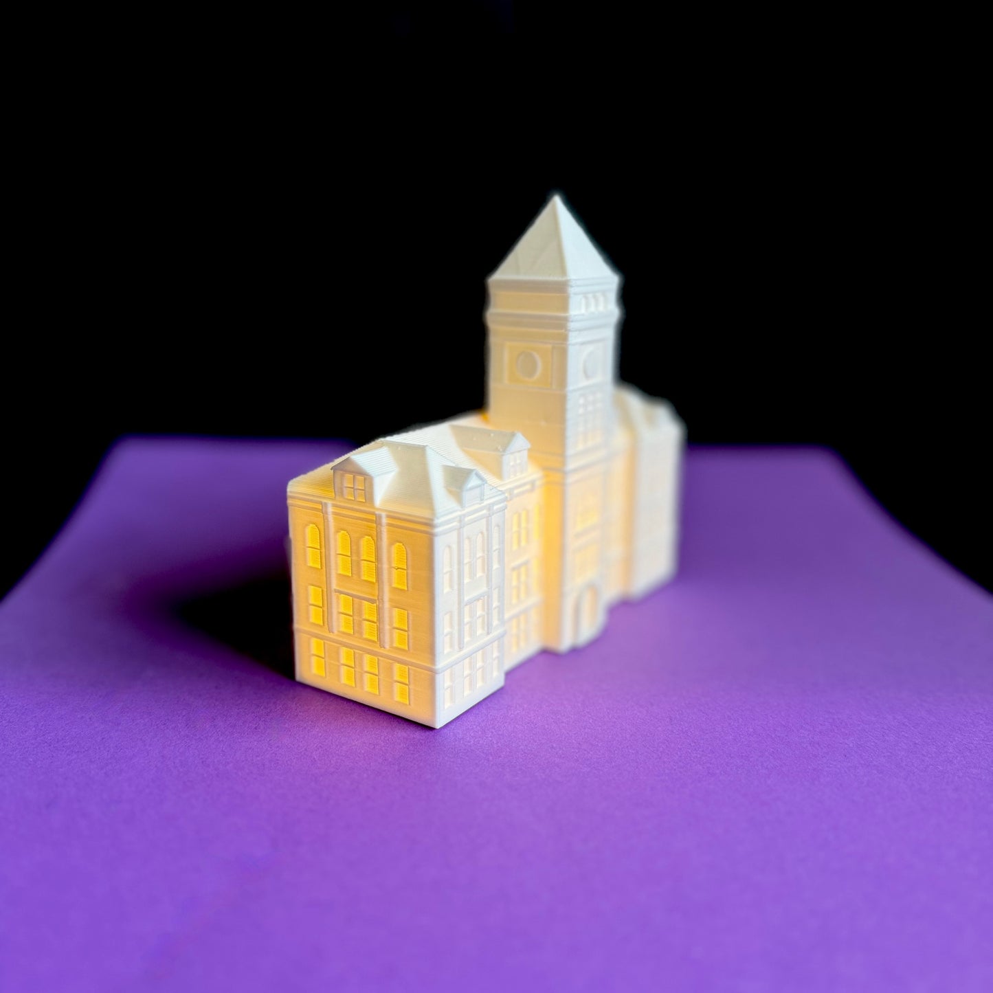 Side view of the Clemson party decoration, designed as a lighted figurine of Tillman Hall.