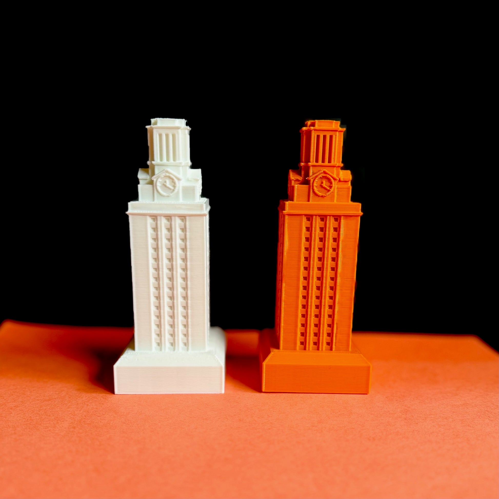 The UT Tower figurines, shown in white and burnt orange.