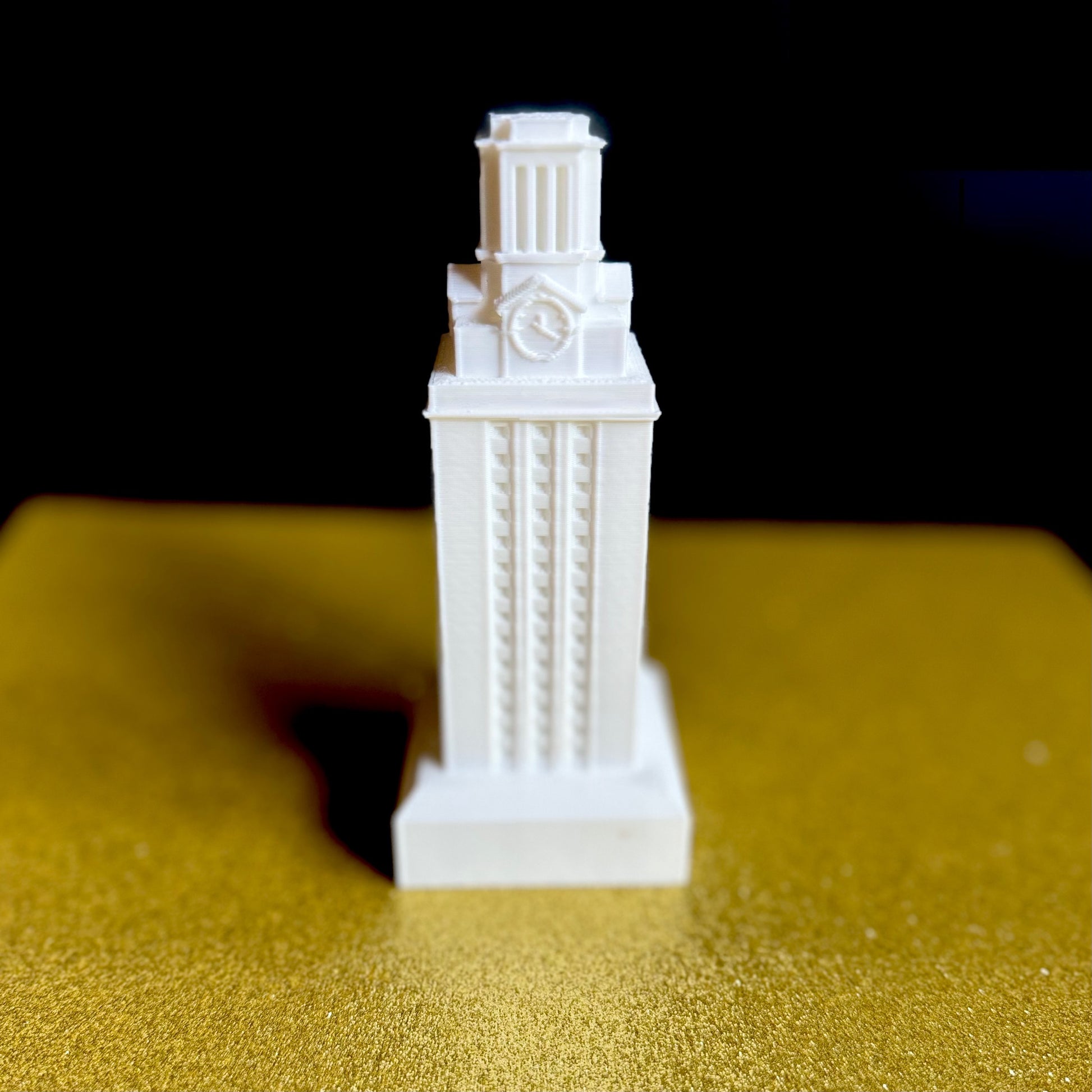 The white University of Texas figurine, used for cake toppers.