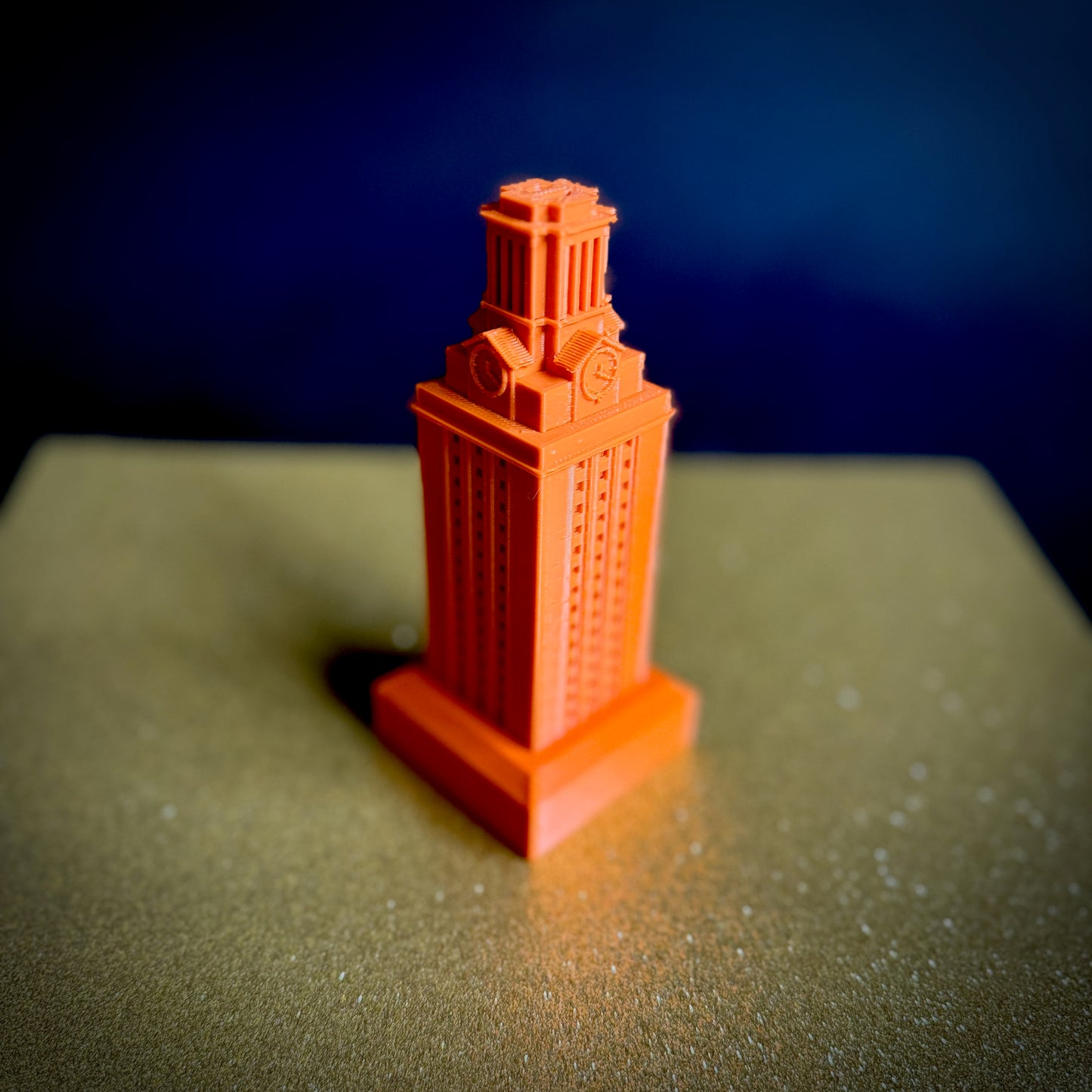 The burnt orange UT Tower decoration, used as a party decor item.