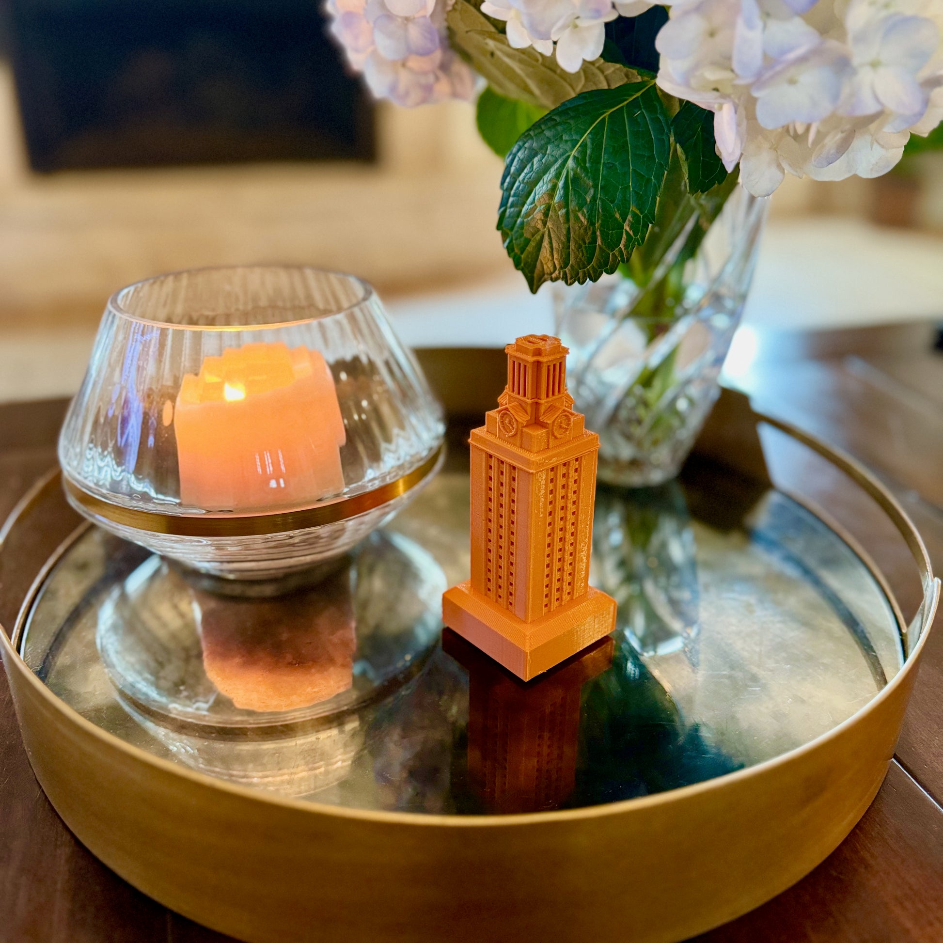 The UT Austin figurine, shown on a living room tray.