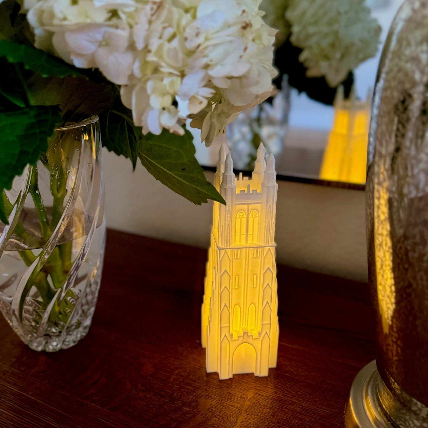 The Duke Chapel keepsake, shown on a bedroom side table.