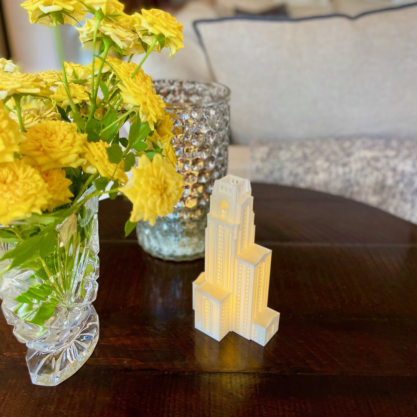 The University of Pittsburgh light of the Cathedral of Learning, shown displayed on a living room side table.