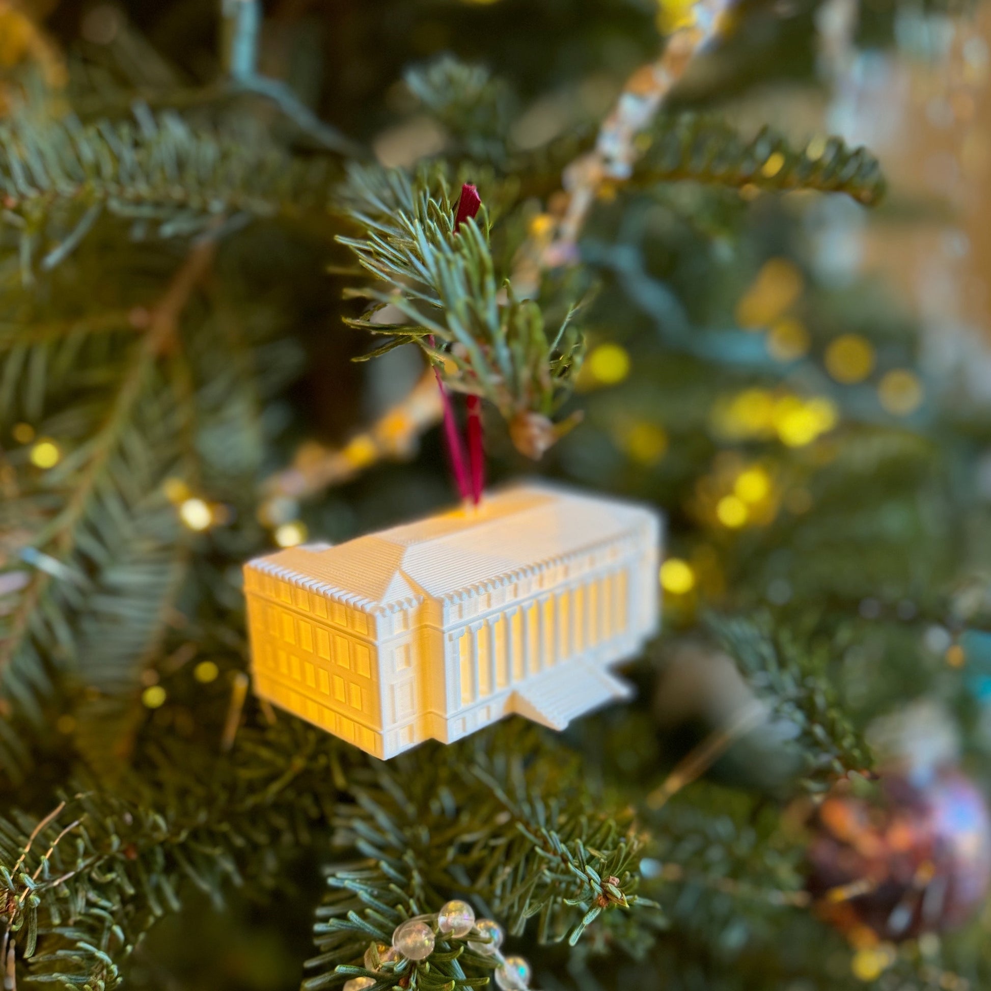 View of the TAMU lighted Christmas ornament, shown on a Christmas tree.