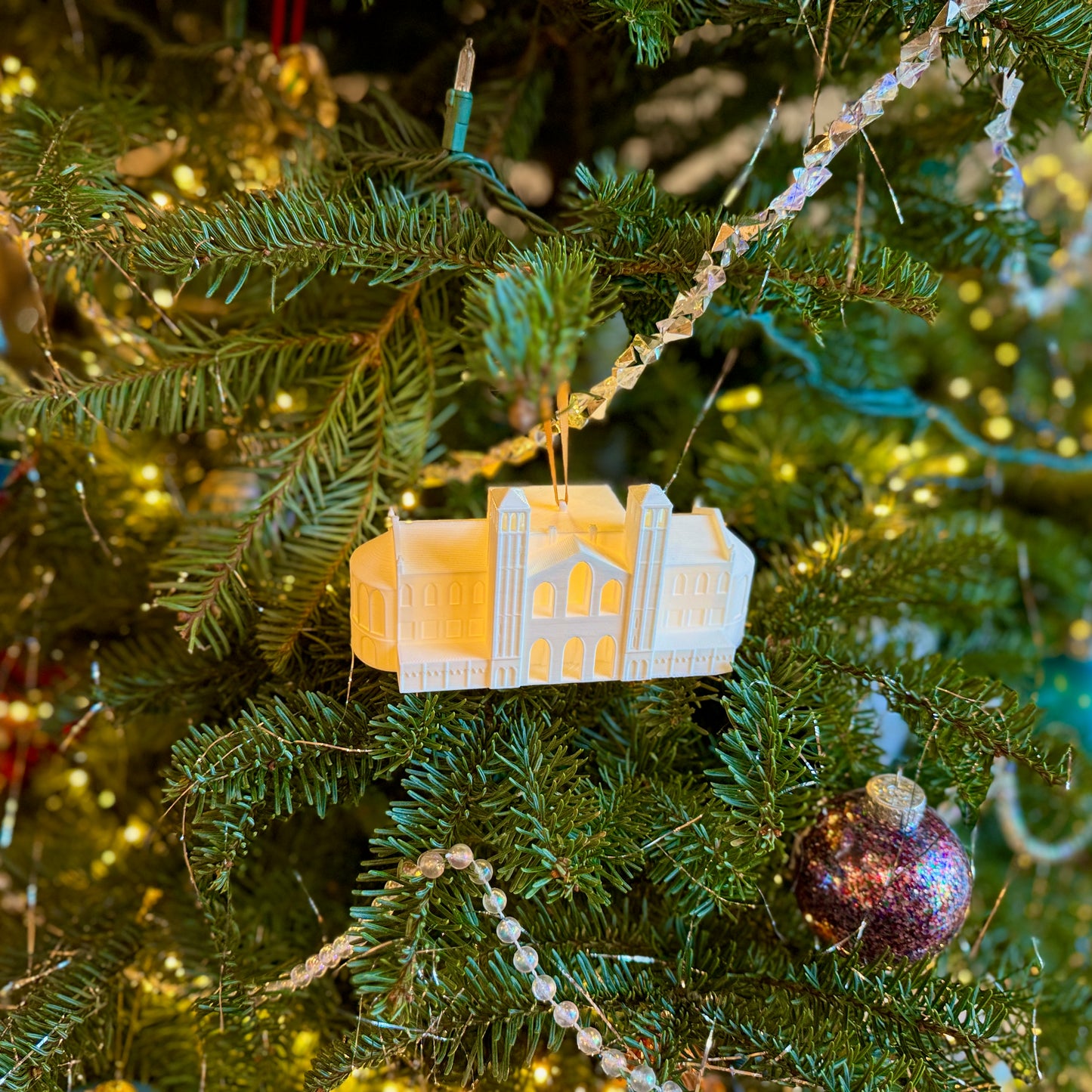 The UCLA lighted ornament, shown on a UCLA tree decorated for the holidays.