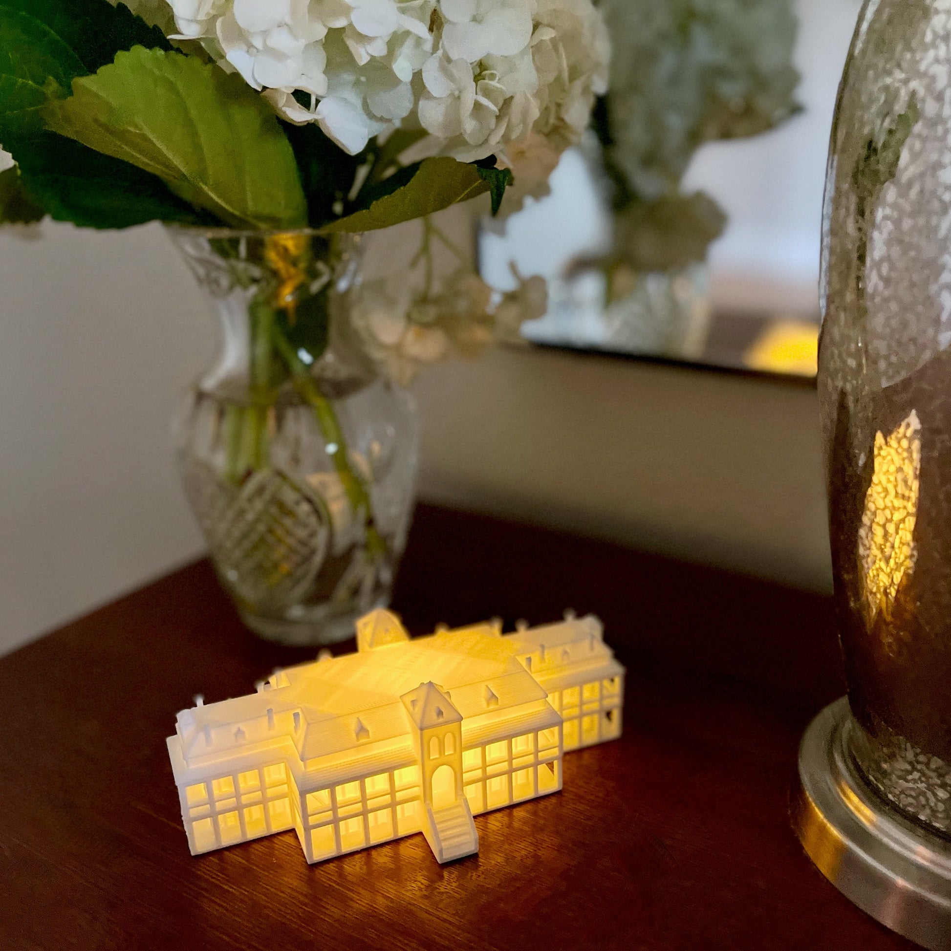 The university of arizona home decor item, a lighted figurine of the Arizona campus building.