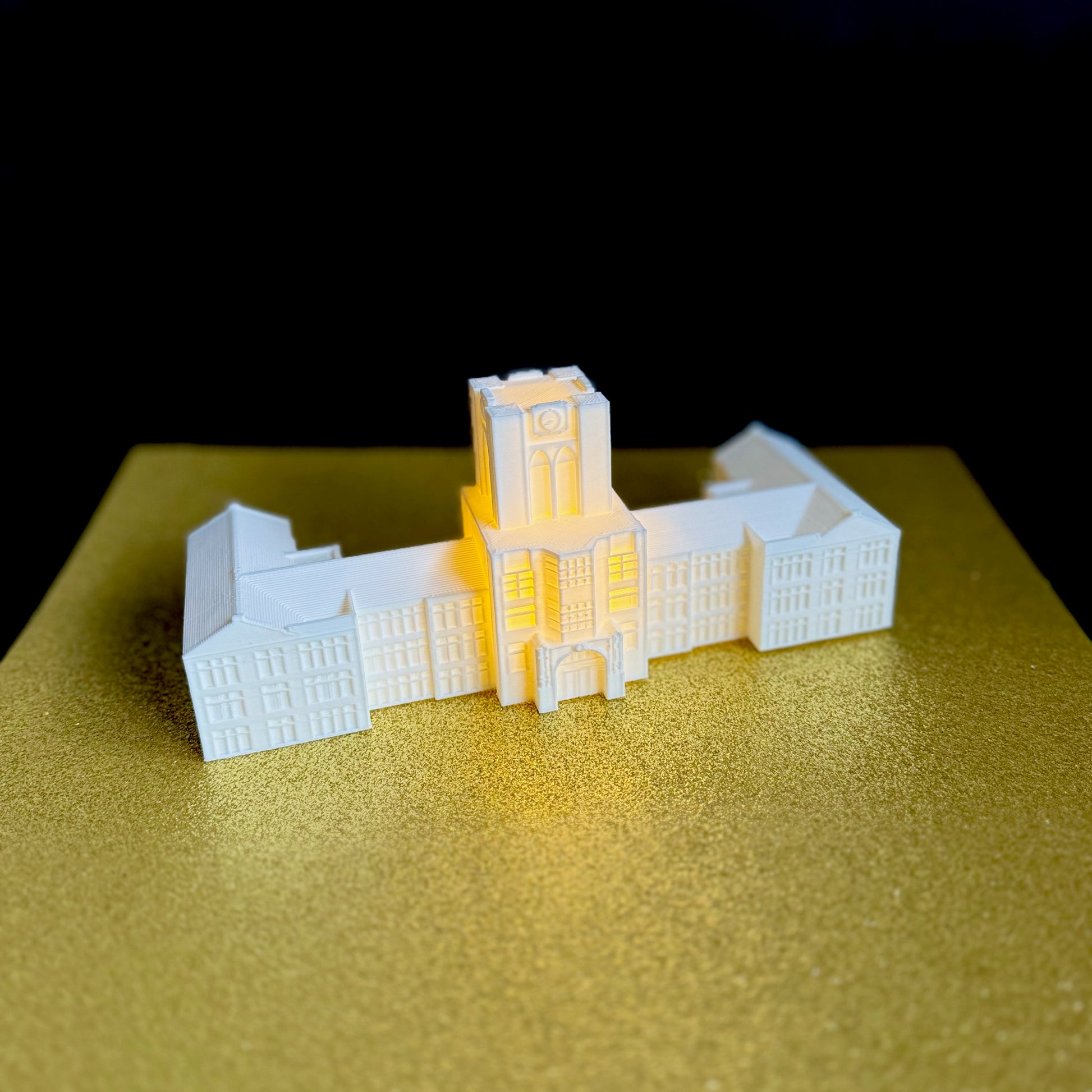 The University of Tennessee lighted cake topper, designed to look like the Tennesseee Ayres Hall building.