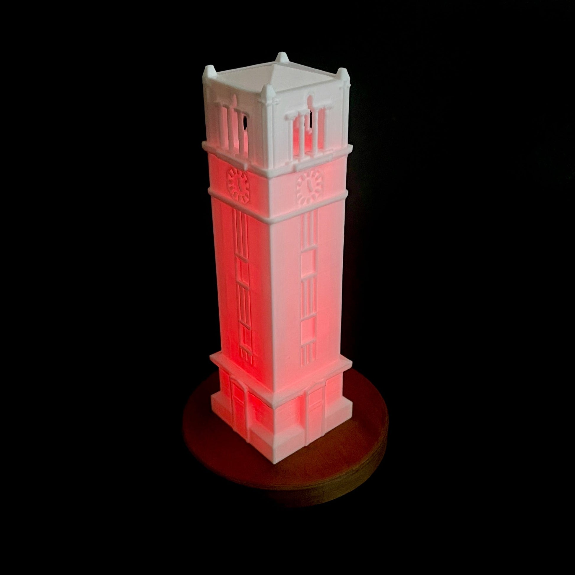 The NC State lamp with a red light, designed as a replica of the NC State Tower.