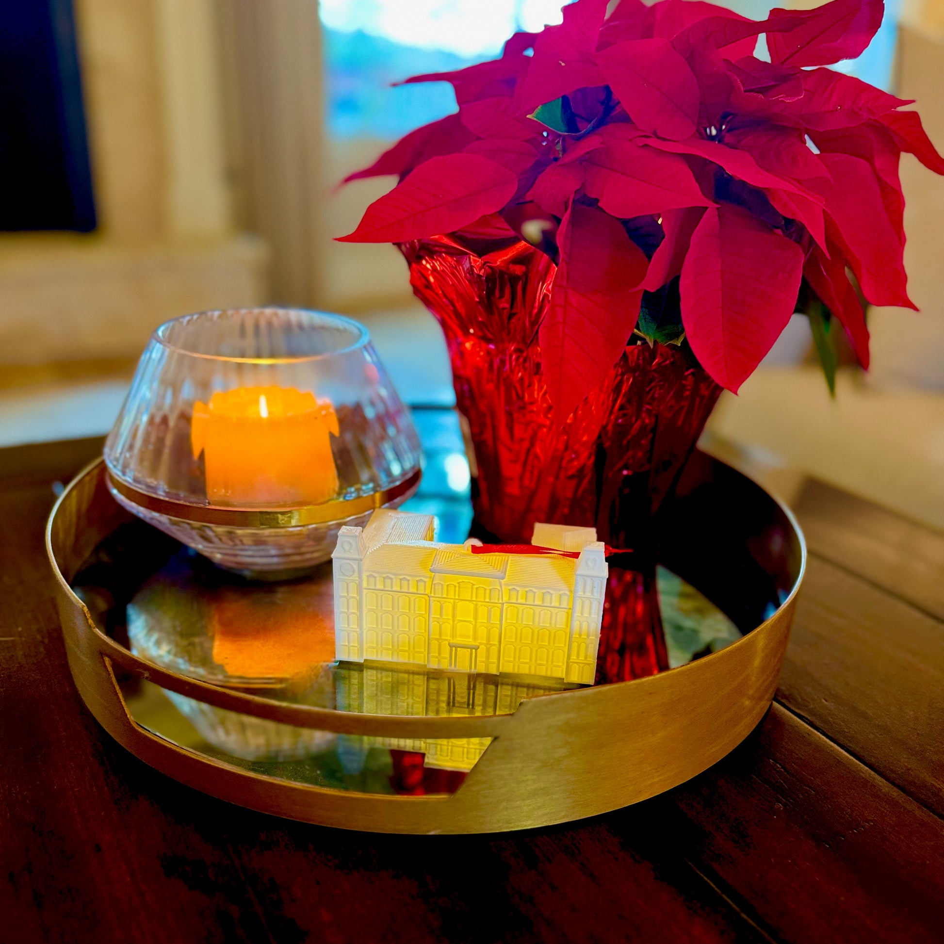 The University of Arkansas lighted ornament, shown on a living room tray styled for Christmas.