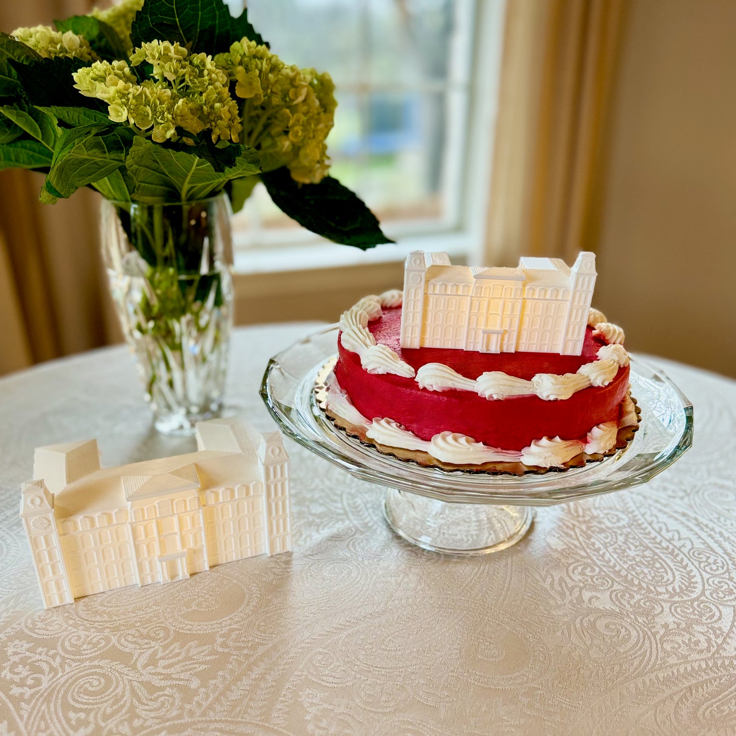 The University of Arkansas party decoration, shown next to the University of Arkansas cake topper, both at a University of Arkansas graduation party.