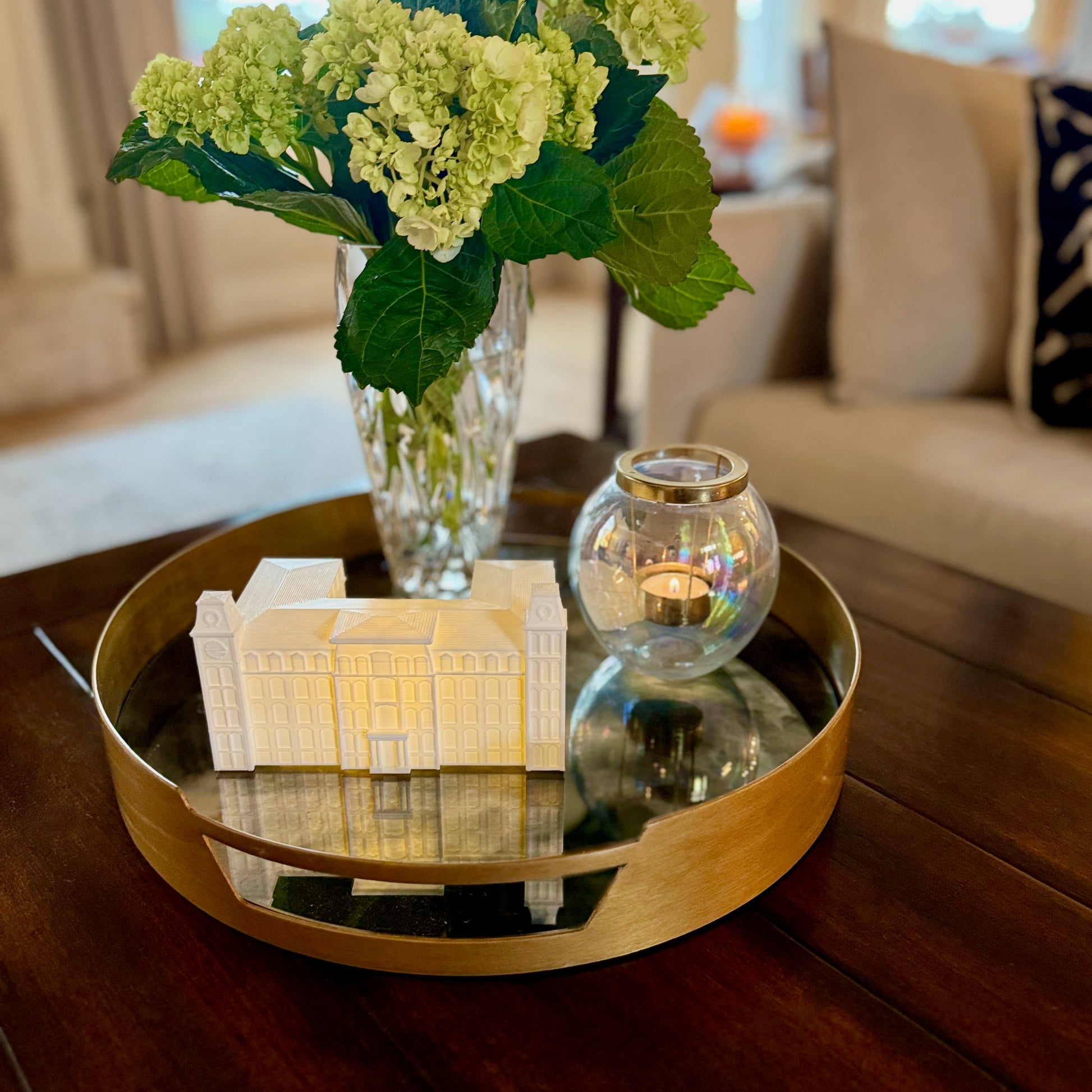 The University of Arkansas apartment decoration, designed as a replica of the Arkansas Old Main and styled in a living room.