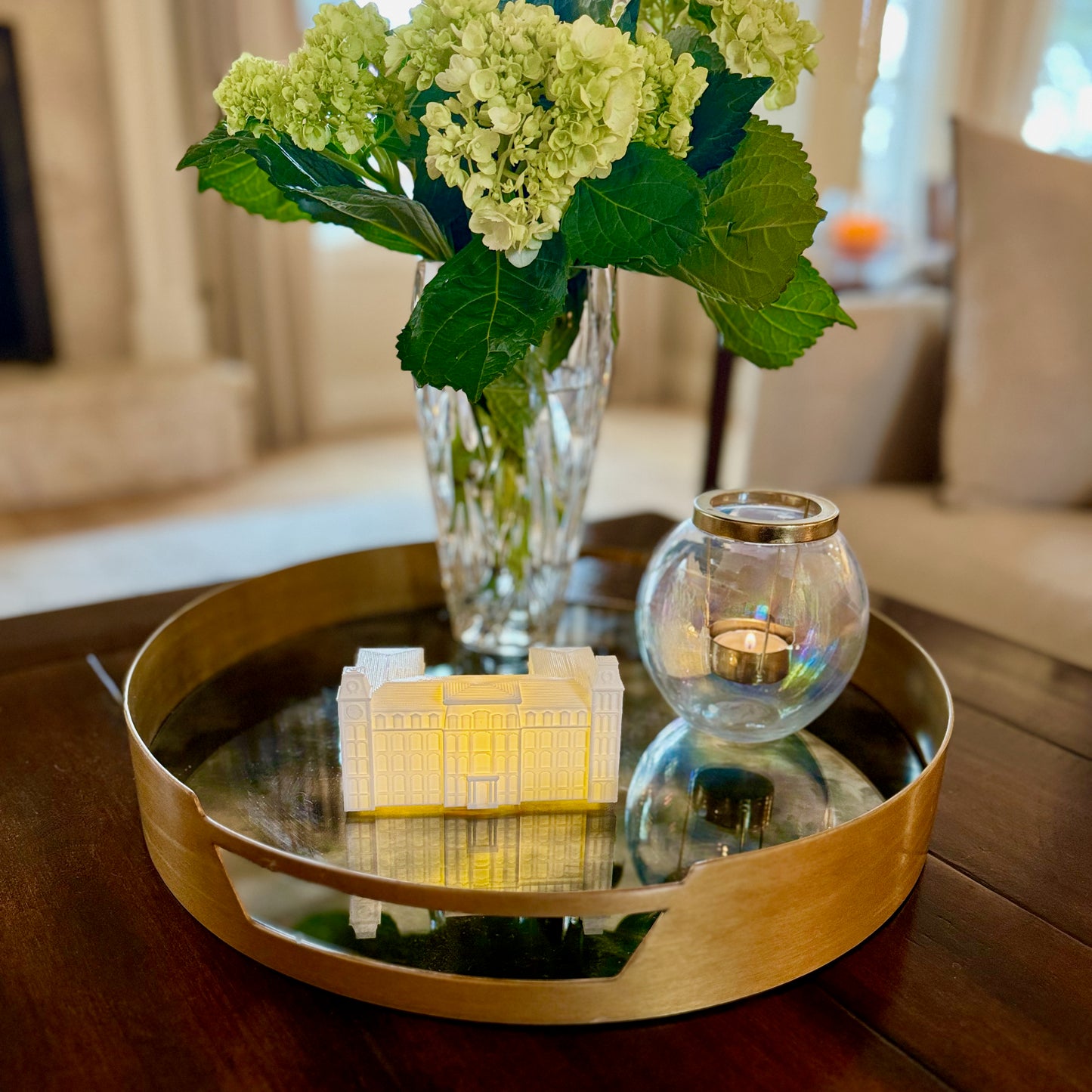 The University of Arkansas party decoration, shown as a centerpiece and designed to look like the Old Main campus building.