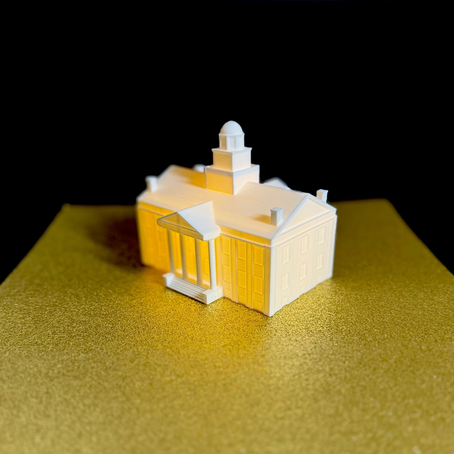 The lighted Old Capitol figurine, used as a University of Iowa college acceptance gift.