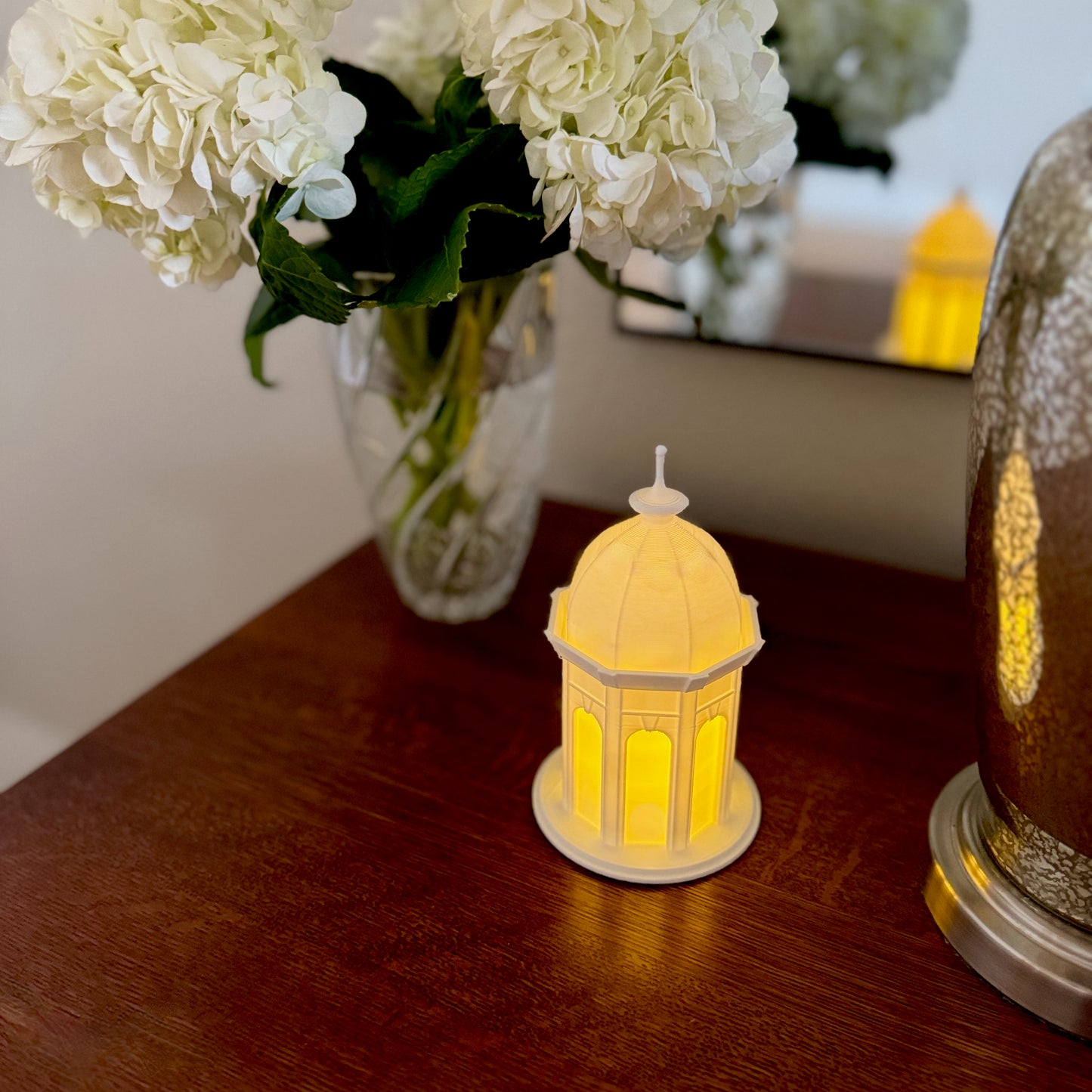 The lighted ECU Cupola decoration, shown on a bedroom side table.