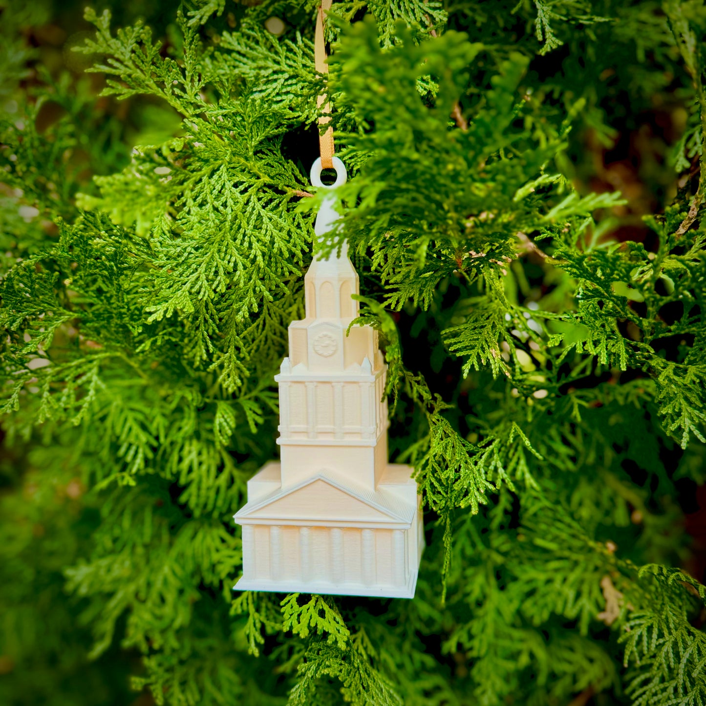 The Wake Forest ornament, designed in honor of the Wait Chapel campus building and shown on a Christmas tree.