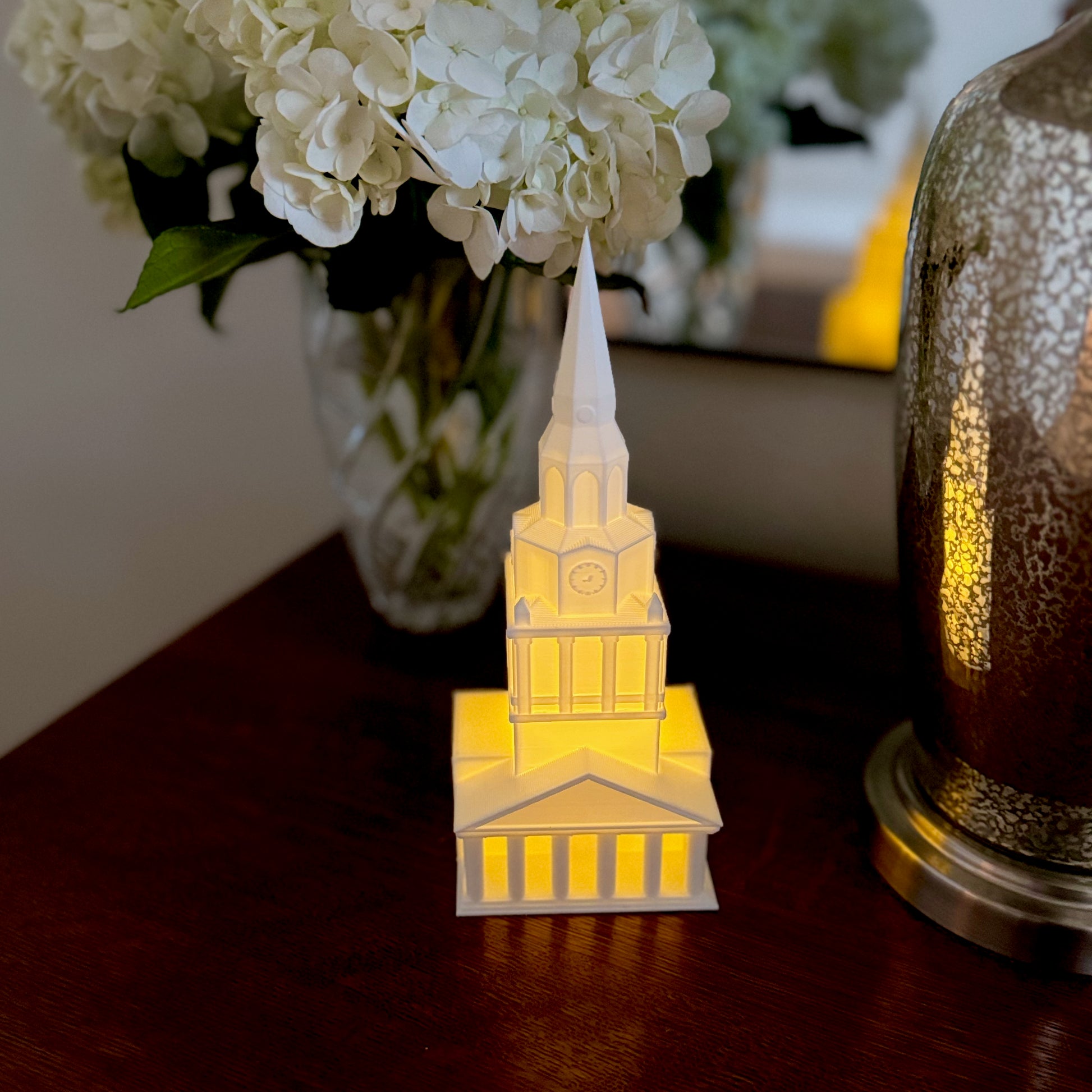 The Wake Forest Wait Chapel figurine, shown on a side table.