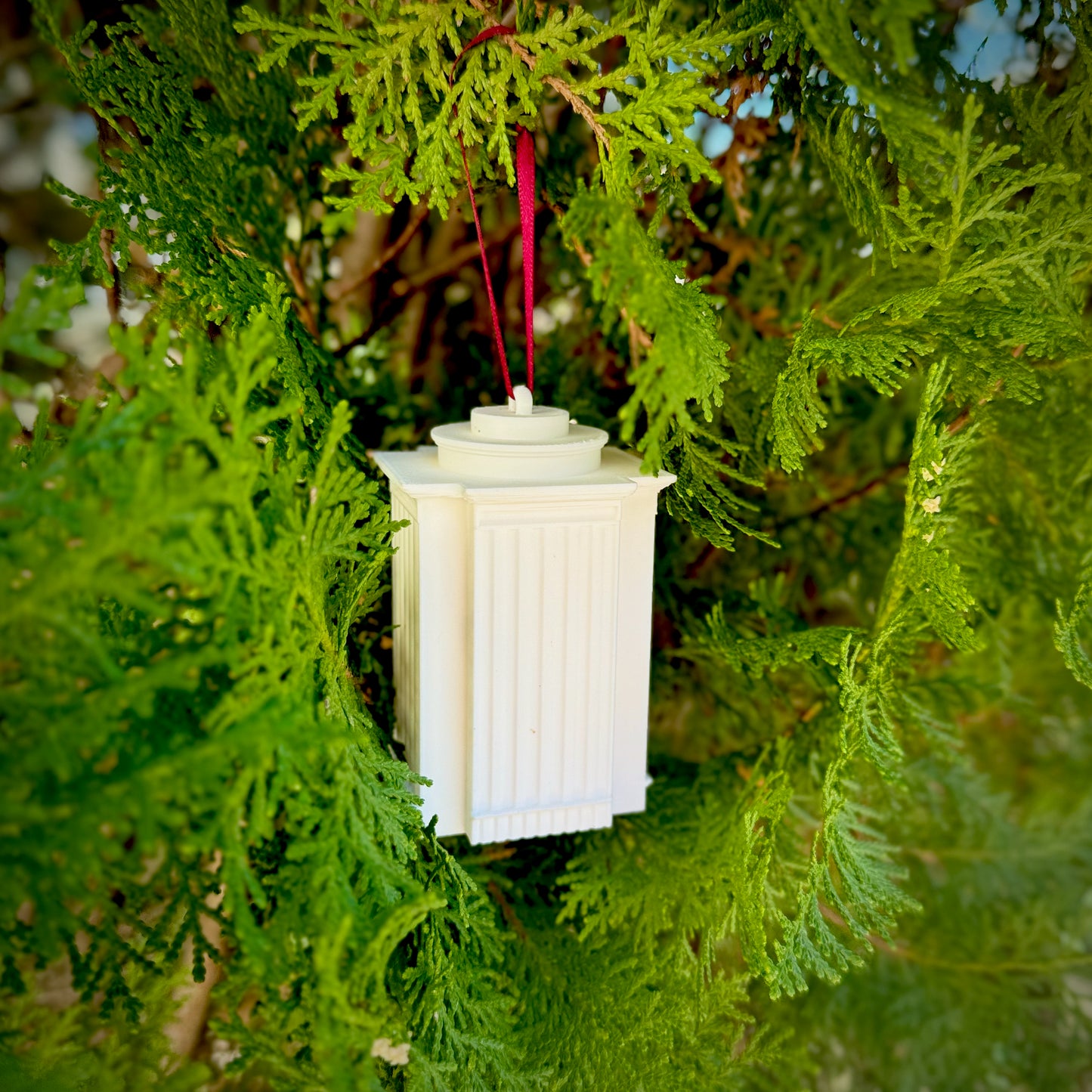 The USC Gamecocks ornament with light, styled after the Capstone Residence Hall.