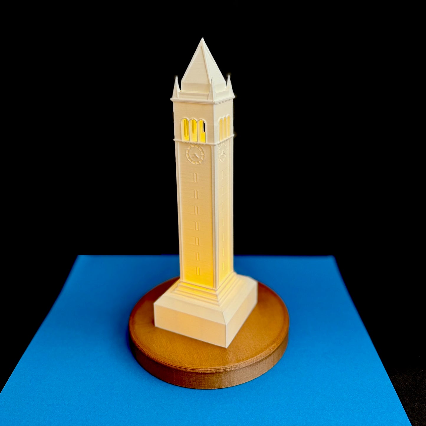 The Berkeley Campanile light, shown against a blue background and used as a Berkeley graduation gift.