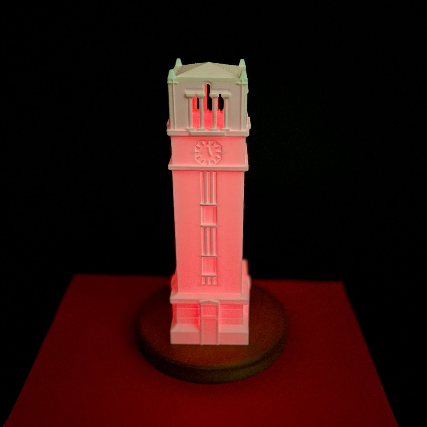 Front view of the lighted NC State desk lamp, shown in red.