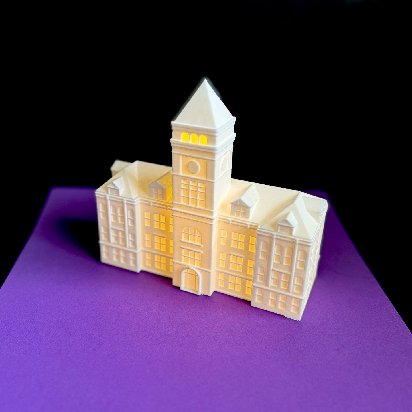 Side view of the Clemson graduation keepsake, designed as a replica of Tillman Hall.