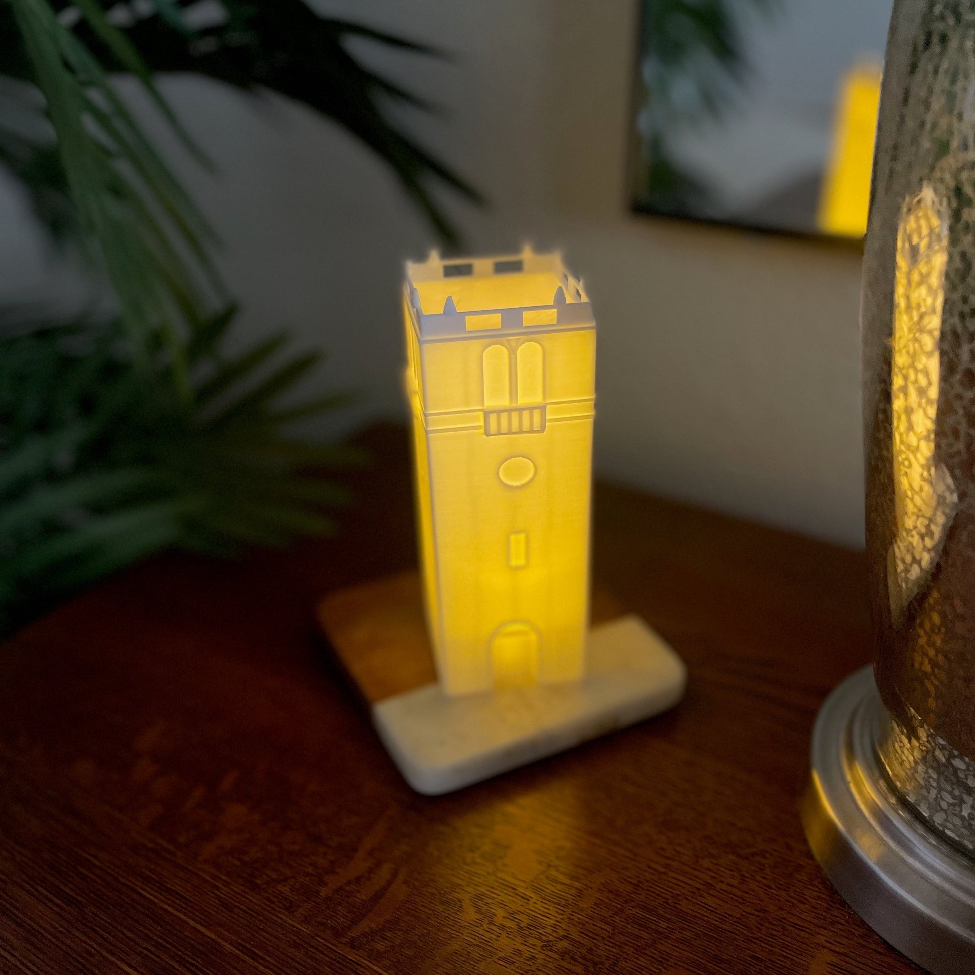 The Wisconsin tower light, shown on a bedroom side table.