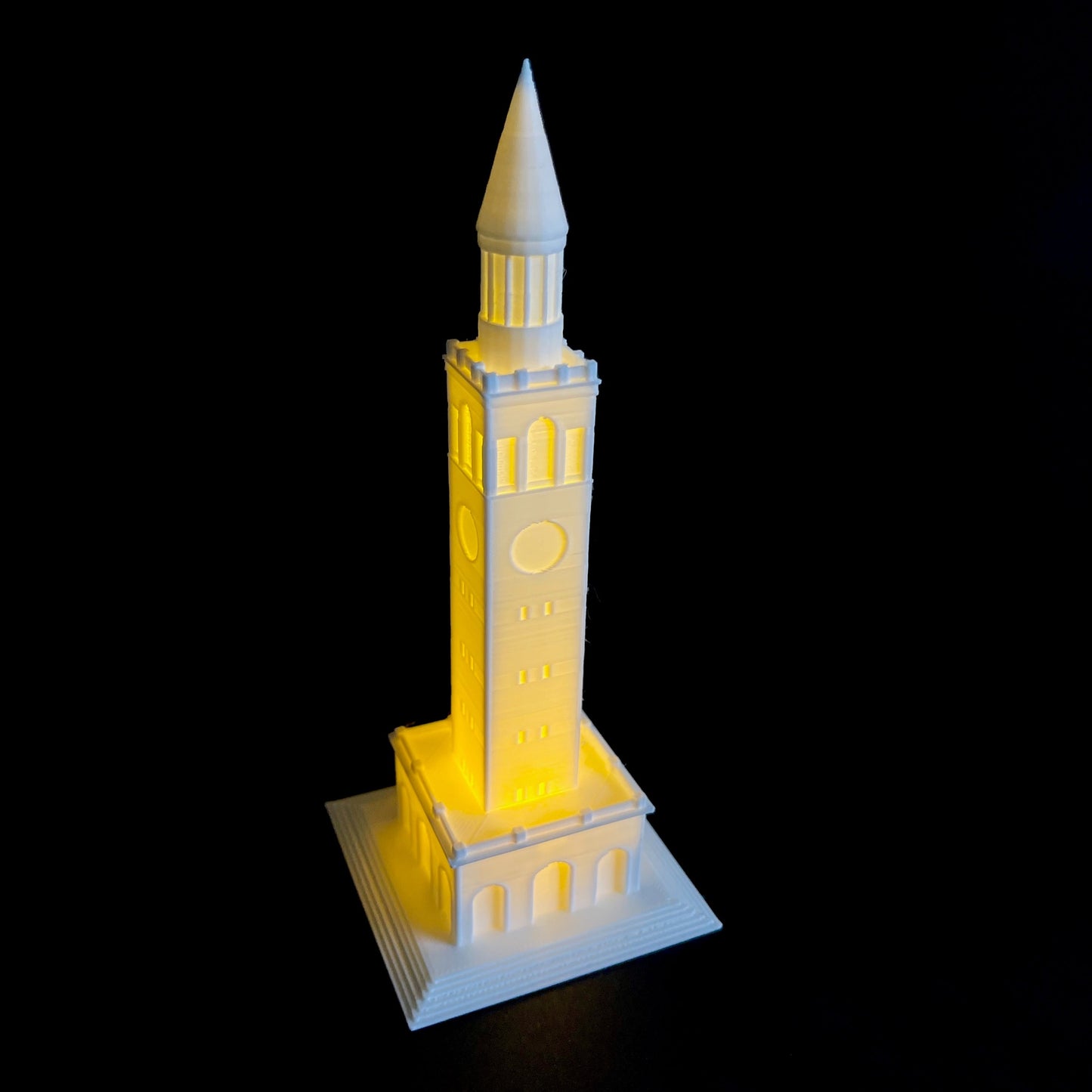 The UNC Chapel Hill lighted figurine, shown against a black background.