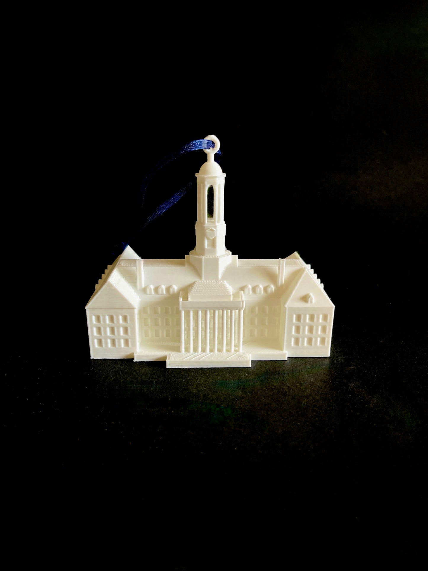 Front view of the Pennsylvania State University ornament, designed as a replica of the Penn State Old Main building.