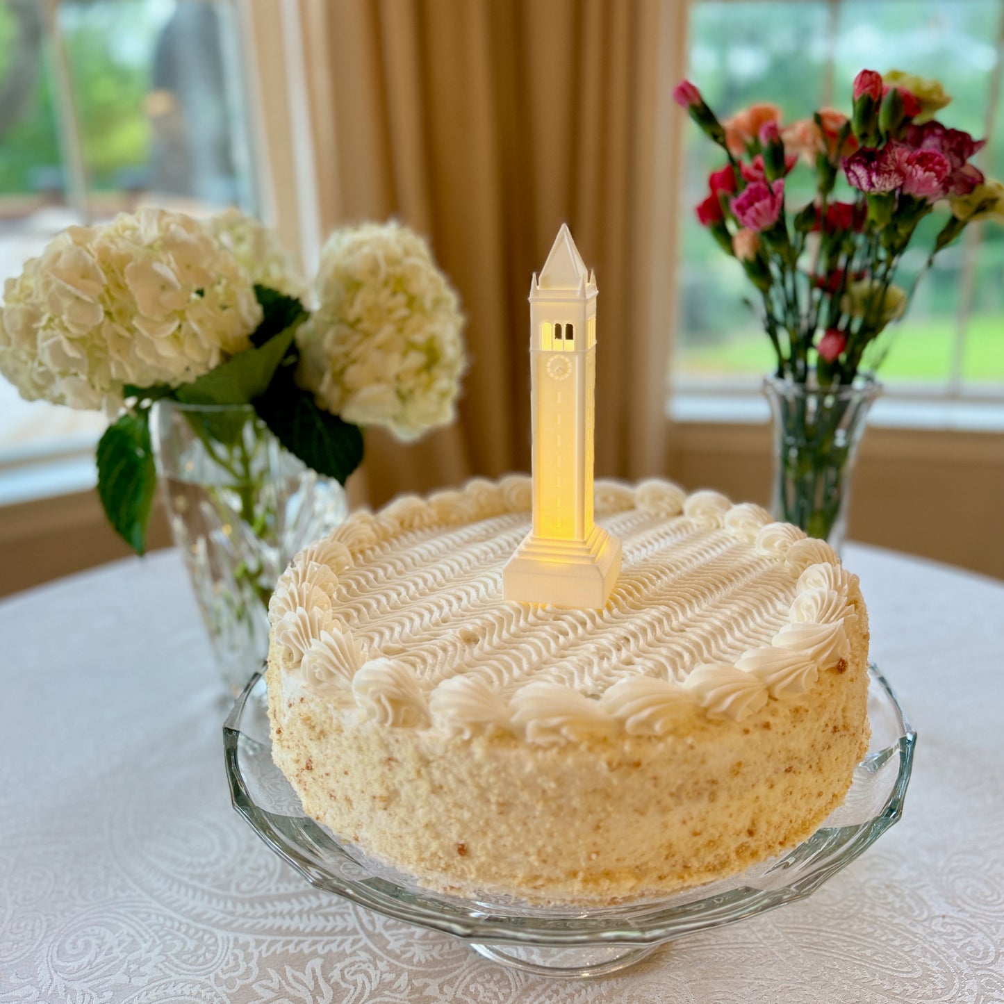 The lighted Berkeley Campanile cake topper, designed as a replica of the Sather Tower (Campanile).