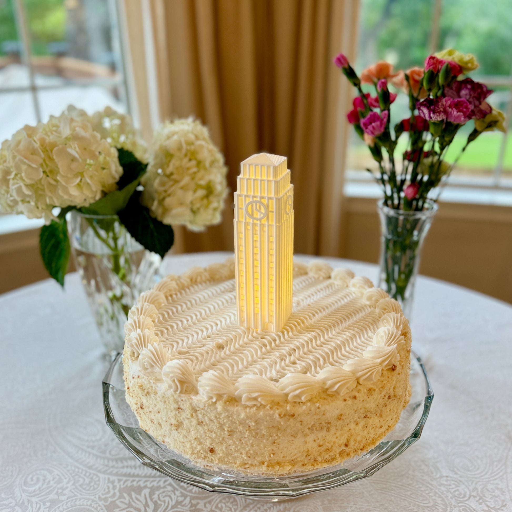 The University of Michigan cake topper light, depicting the Burton Tower.